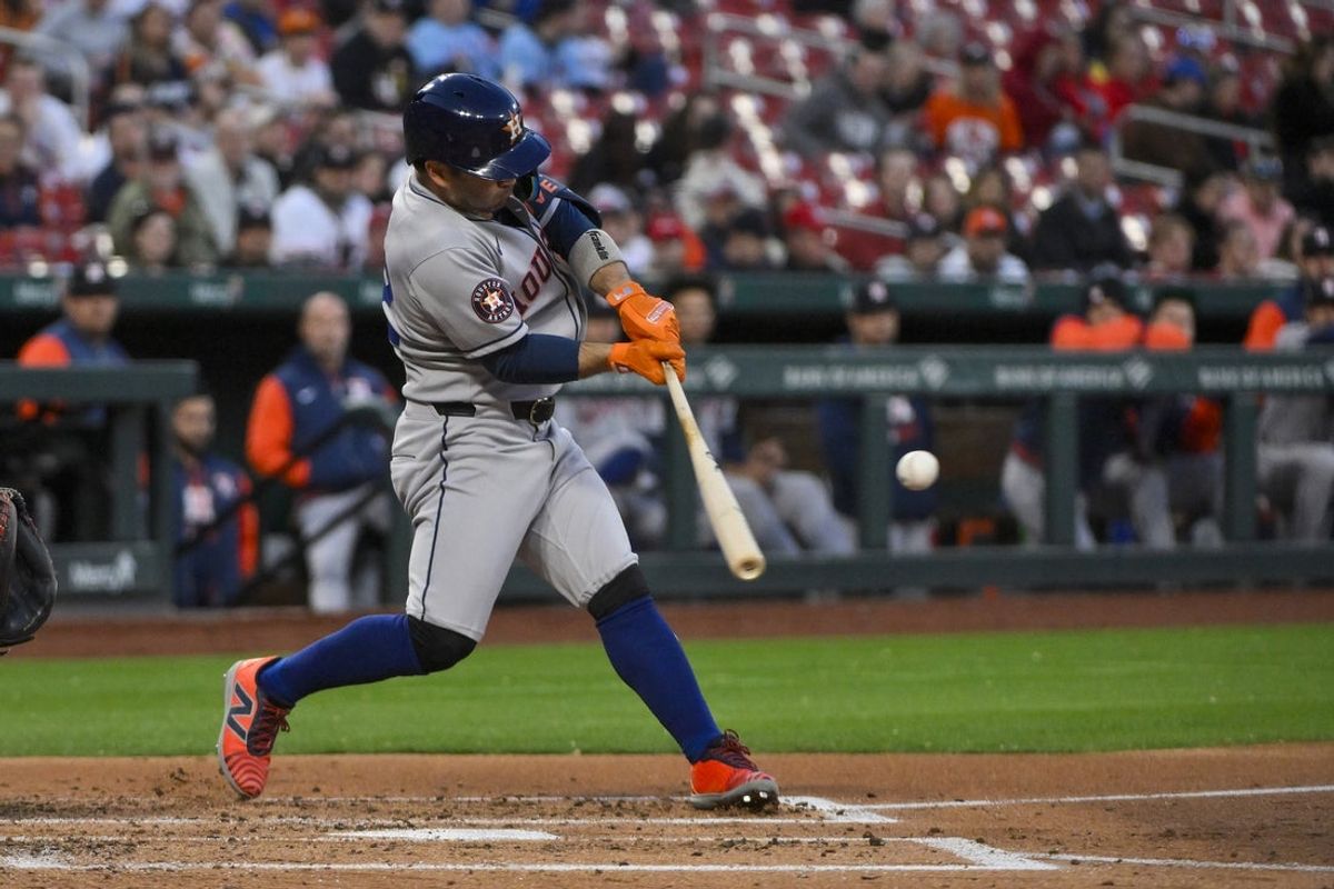 Apr 15, 2025; St. Louis, Missouri, USA;  Houston Astros designated hitter Jose Altuve (27) hits a double against the St. Louis Cardinals during the third inning at Busch Stadium. Mandatory Credit: Jeff Curry-Imagn Images