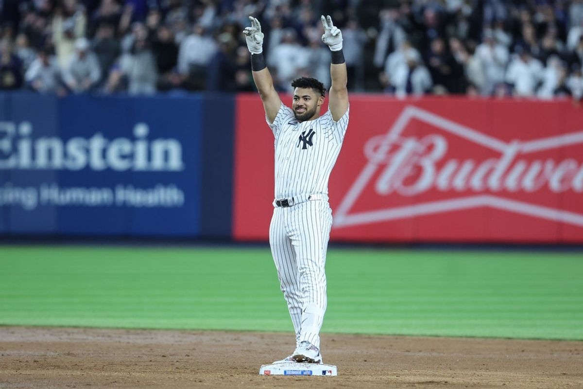 Apr 15, 2025; Bronx, New York, USA;  New York Yankees left fielder Jasson Dominguez (24) gestures after hitting a three run double in the sixth inning against the Kansas City Royals at Yankee Stadium. All players wore #42 for Jackie Robinson Day.  Mandatory Credit: Wendell Cruz-Imagn Images