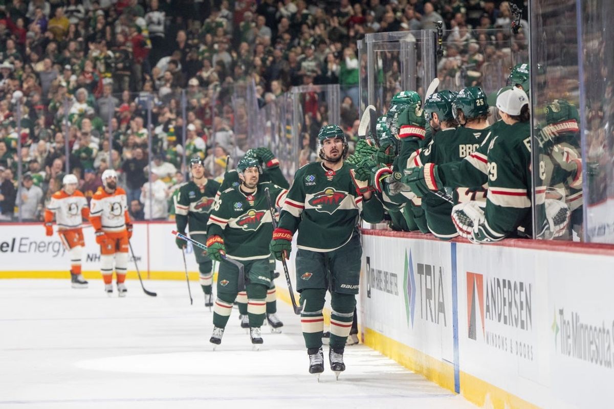 Apr 15, 2025; Saint Paul, Minnesota, USA; Minnesota Wild left wing Marcus Johansson (90) leads the team to the bench after scoring against the Anaheim Ducks in the first period at Xcel Energy Center. Mandatory Credit: Matt Blewett-Imagn Images