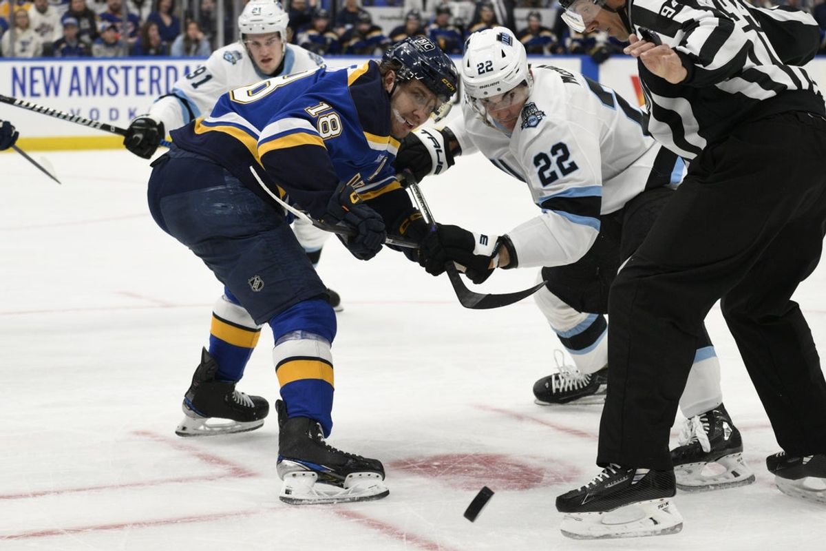 Apr 15, 2025; St. Louis, Missouri, USA; St. Louis Blues center Robert Thomas (18) takes the face-off against Utah Hockey Club center Jack McBain (22) during the first period at Enterprise Center. Mandatory Credit: Jeff Le-Imagn Images
