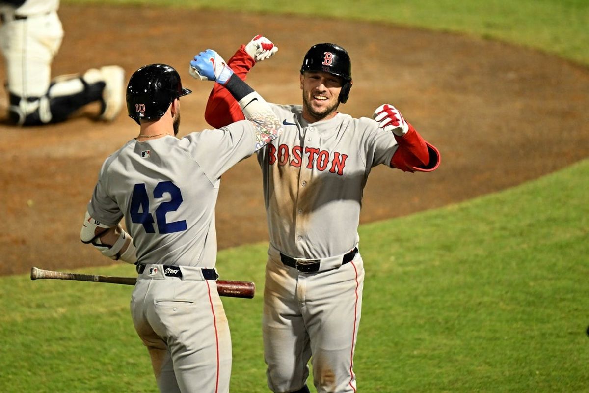Apr 15, 2025; St. Petersburg, Florida, USA; Boston Red Sox third baseman Alex Bergman (2) celebrates with short stop Trevor Story (10)after hitting a solo home run in the seventh  inning against the Tampa Bay Rays at George M. Steinbrenner Field.  All Players wore #42 in honor of Jackie Robinson Day.. Mandatory Credit: Jonathan Dyer-Imagn Images