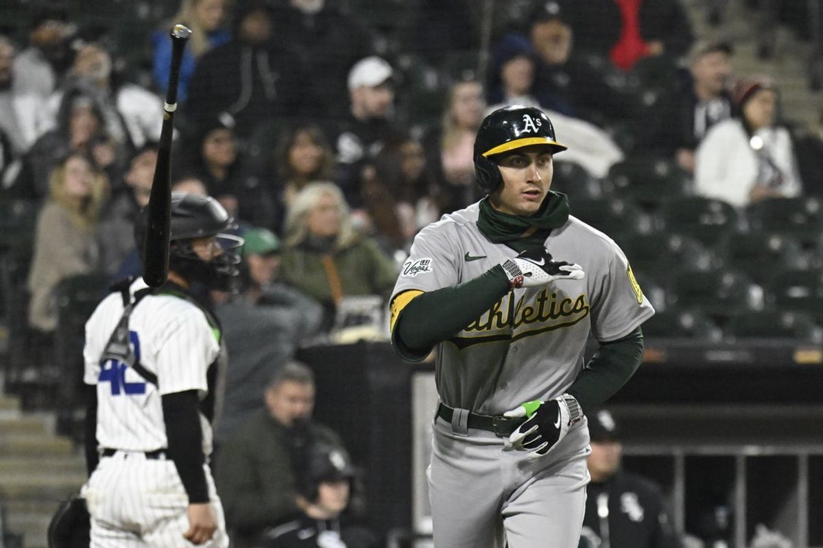 Apr 15, 2025; Chicago, Illinois, USA;  Athletics first baseman Tyler Soderstrom (21) flips his bat after he hits a three run home run against the Chicago White Sox  during the sixth inning at Rate Field.  “All players wore #42 for Jackie Robinson Day” Mandatory Credit: Matt Marton-Imagn Images.