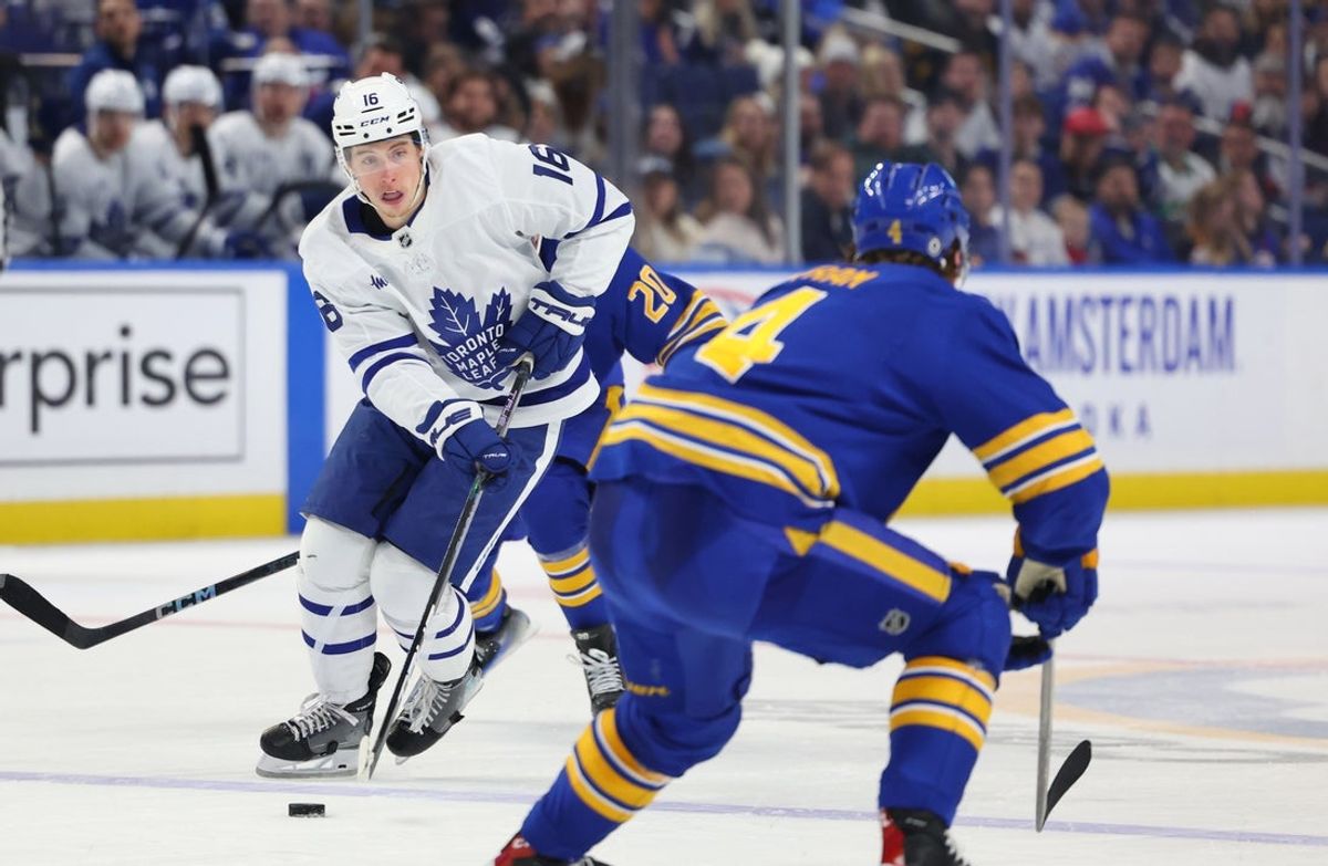 Apr 15, 2025; Buffalo, New York, USA;  Toronto Maple Leafs right wing Mitch Marner (16) skates up ice with the puck during the third period against the Buffalo Sabres at KeyBank Center. Mandatory Credit: Timothy T. Ludwig-Imagn Images
