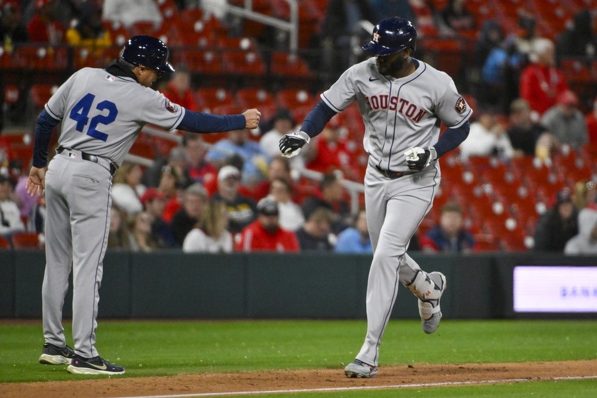 Apr 15, 2025; St. Louis, Missouri, USA;  Houston Astros designated hitter Yordan Alvarez (44) is congratulated by third base coach Tony Perezchica (12) after hitting a solo home run against the St. Louis Cardinals during the eighth inning at Busch Stadium. Mandatory Credit: Jeff Curry-Imagn Images