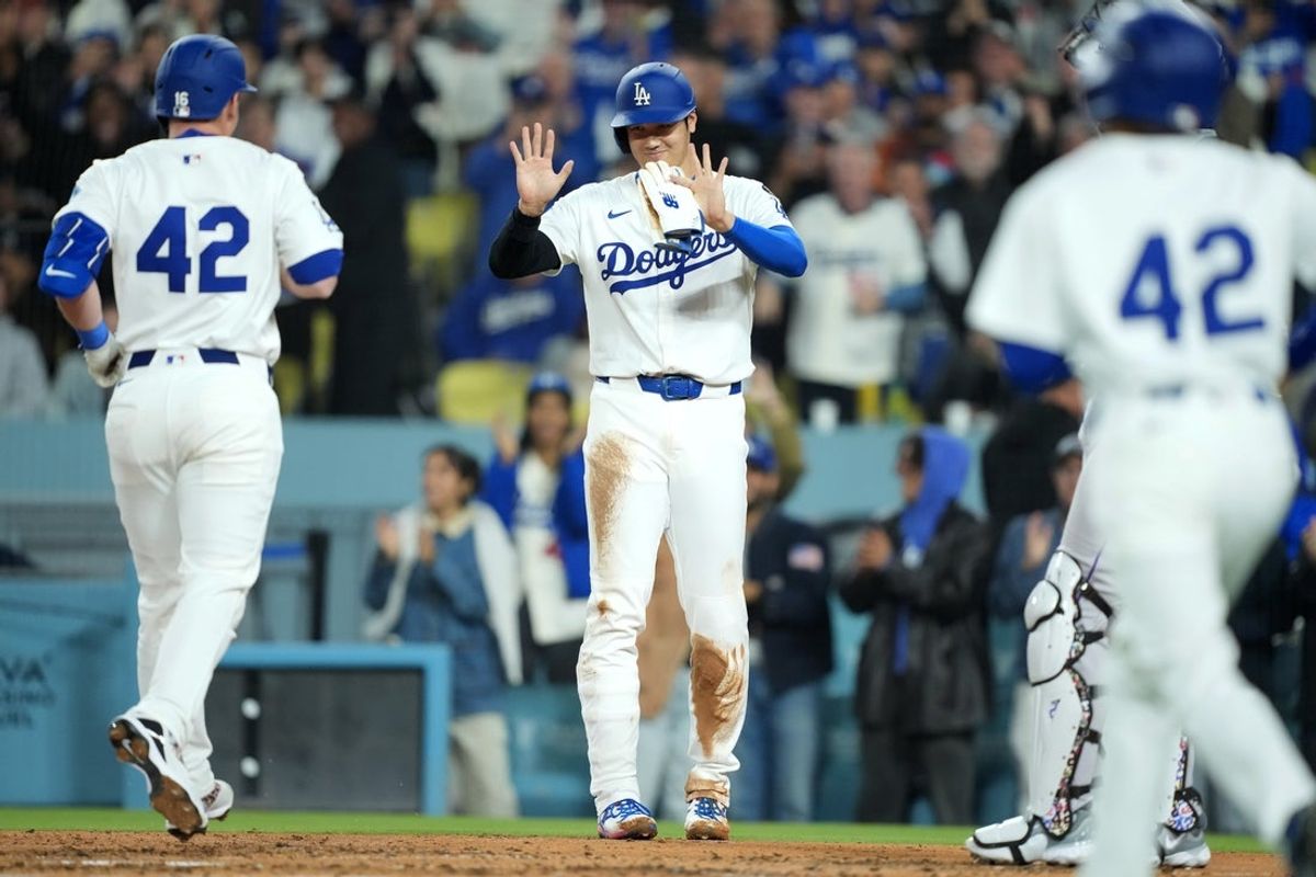 Apr 15, 2025; Los Angeles, California, USA; Los Angeles Dodgers catcher Will Smith (16) celebrates with designated hitter Shohei Ohtani (17) after hitting a three run home run in the third inning against the Colorado Rockies at Dodger Stadium. All players wore #42 for Jackie Robinson Day. Mandatory Credit: Kirby Lee-Imagn Images