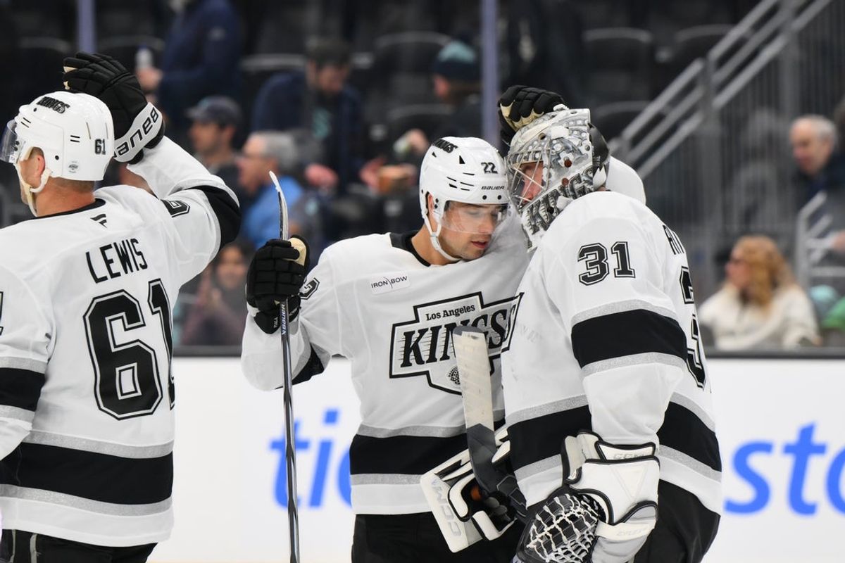 Apr 15, 2025; Seattle, Washington, USA; Los Angeles Kings left wing Kevin Fiala (22) and goaltender David Rittich (31) celebrate after defeating the Seattle Kraken at Climate Pledge Arena. Mandatory Credit: Steven Bisig-Imagn Images