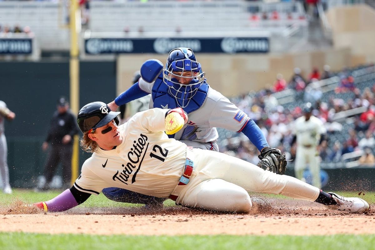 Apr 16, 2025; Minneapolis, Minnesota, USA; New York Mets catcher Hayden Senger (30) tags out Minnesota Twins left fielder Harrison Bader (12) at home plate during the sixth inning at Target Field. Mandatory Credit: Matt Krohn-Imagn Images