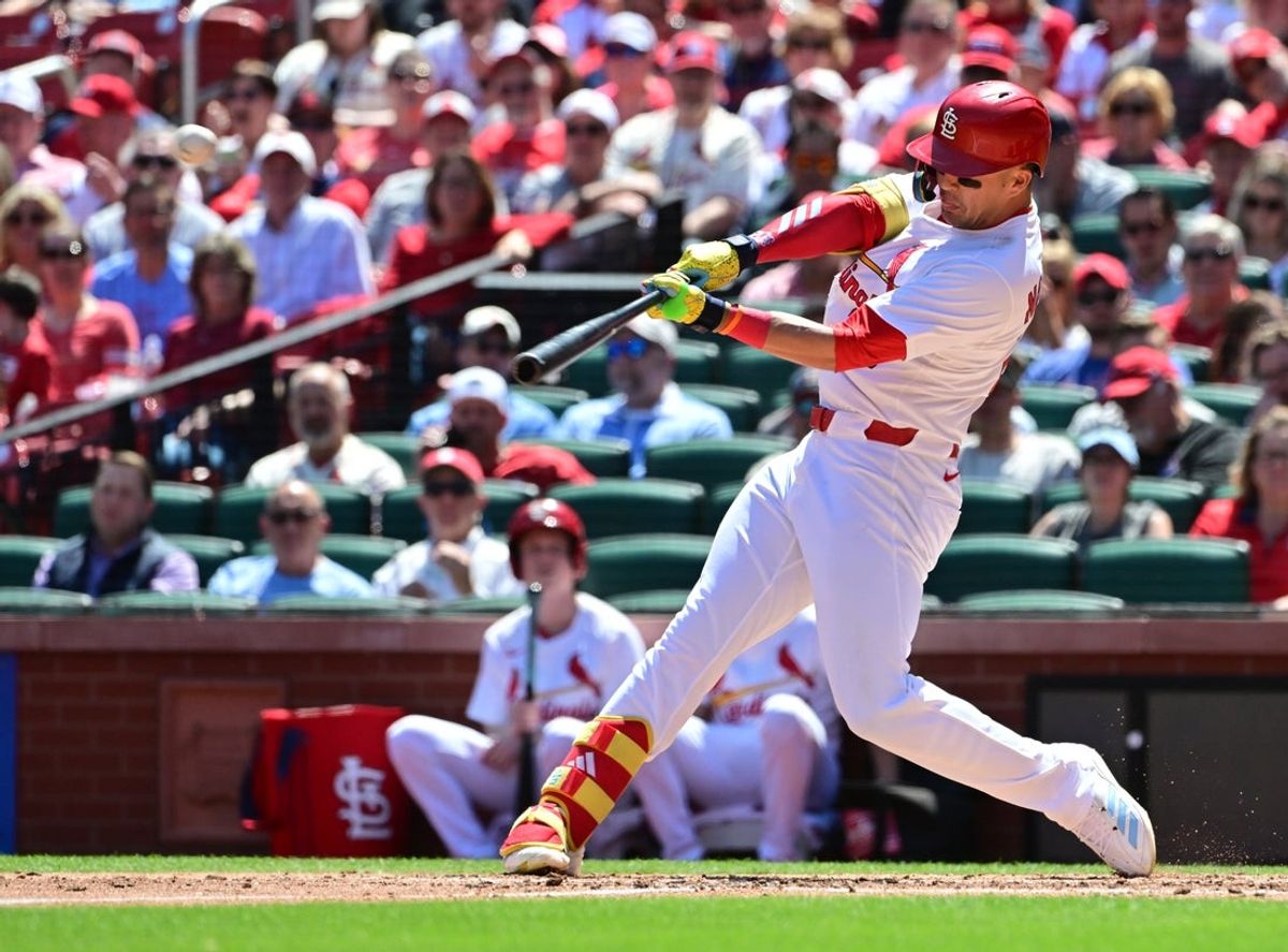Apr 16, 2025; St. Louis, St. Louis Cardinals outfielder Lars Nootbaar (21) hits a three-run home run in the fifth inning against the Houston Astros at Busch Stadium. Mandatory Credit: Tim Vizer-Imagn Images