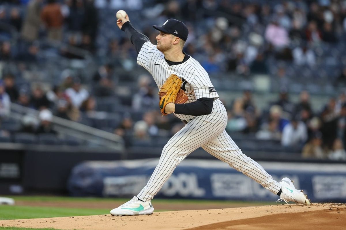 Apr 16, 2025; Bronx, New York, USA;  New York Yankees starting pitcher Clarke Schmidt pitches in the first inning against the Kansas City Royals at Yankee Stadium. Mandatory Credit: Wendell Cruz-Imagn Images
