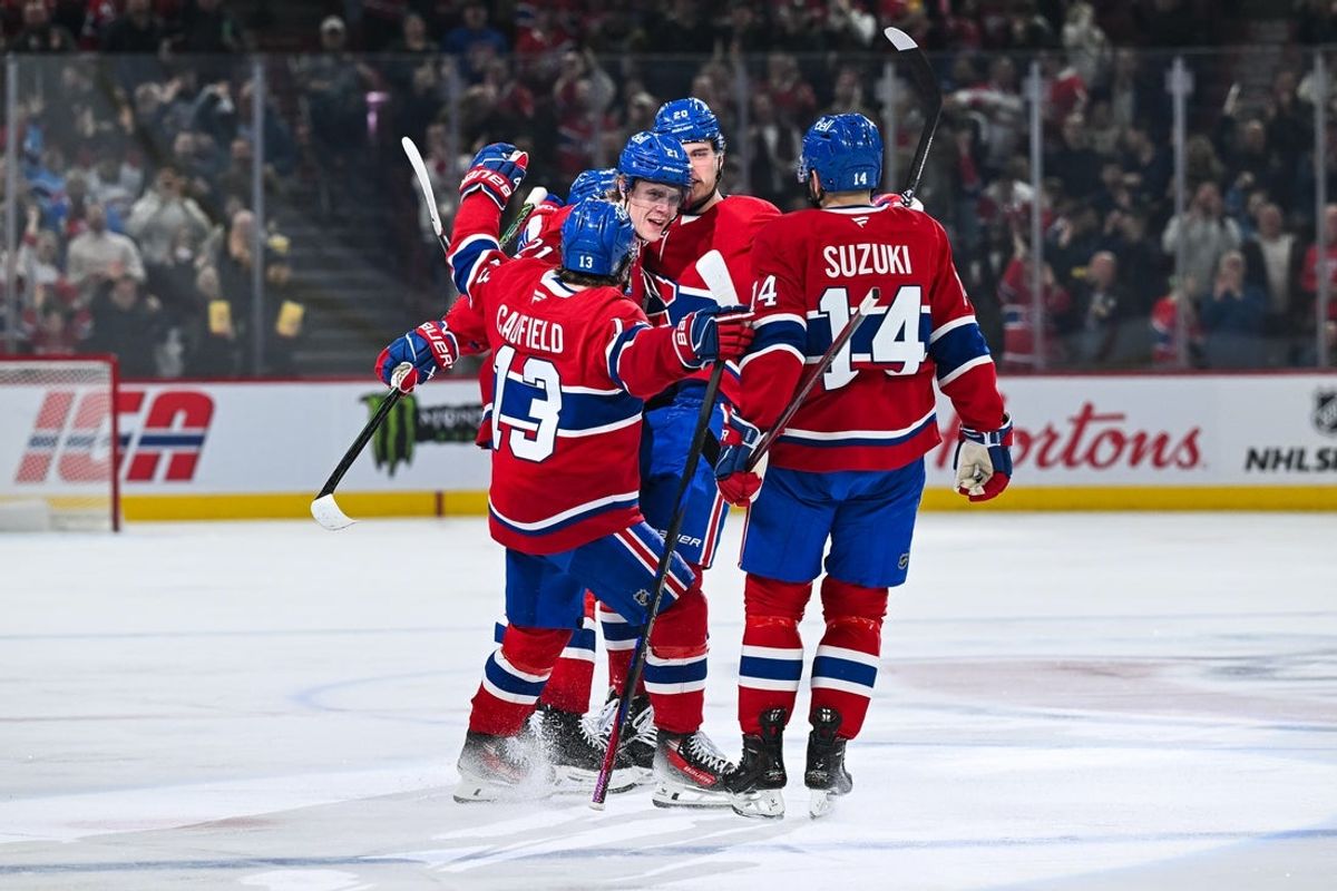Apr 16, 2025; Montreal, Quebec, CAN; Montreal Canadiens defenseman Kaiden Guhle (21) celebrates with his teammates his goal against the Carolina Hurricanes in the first period at Bell Centre. Mandatory Credit: David Kirouac-Imagn Images
