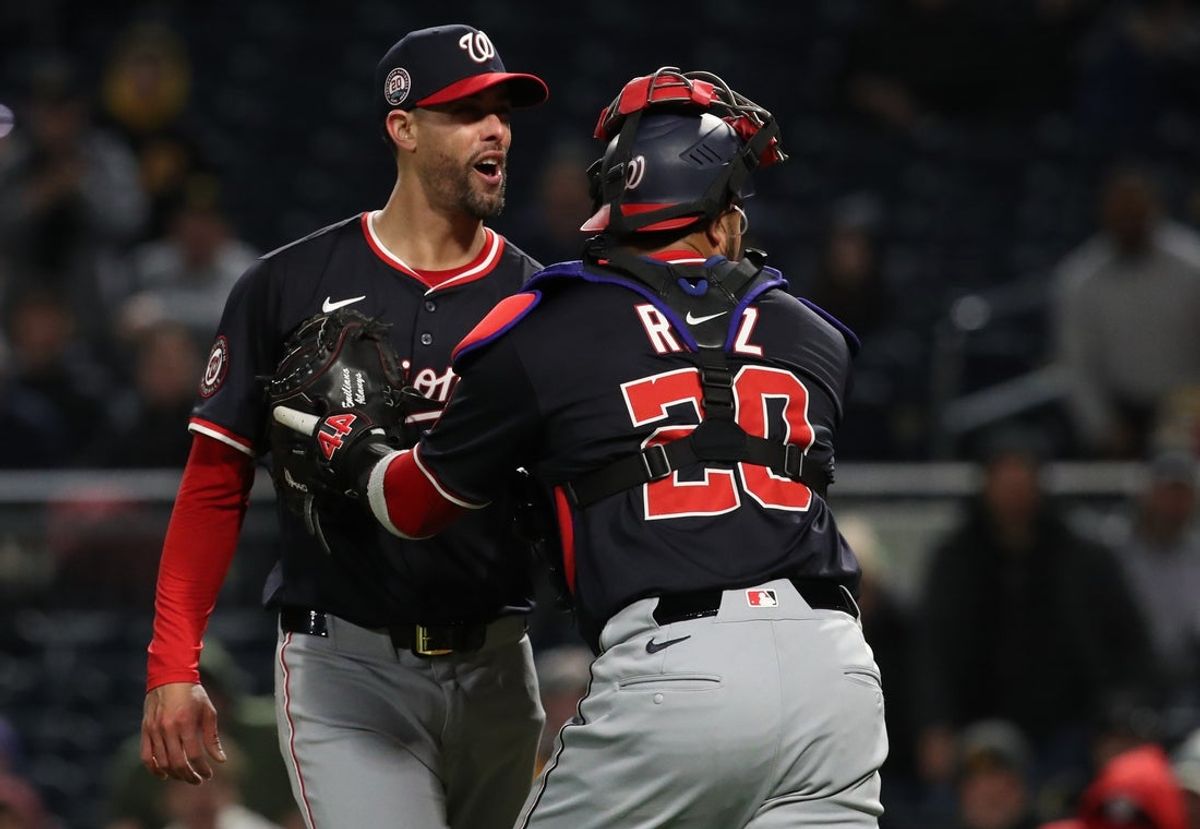 Apr 16, 2025; Pittsburgh, Pennsylvania, USA;  Washington Nationals relief pitcher Jorge Lopez (21) is restrained by catcher Keibert Ruiz (20) as Lopez has words with Pittsburgh Pirates right fielder Andrew McCutchen (not pictured) during the seventh inning at PNC Park. Mandatory Credit: Charles LeClaire-Imagn Images