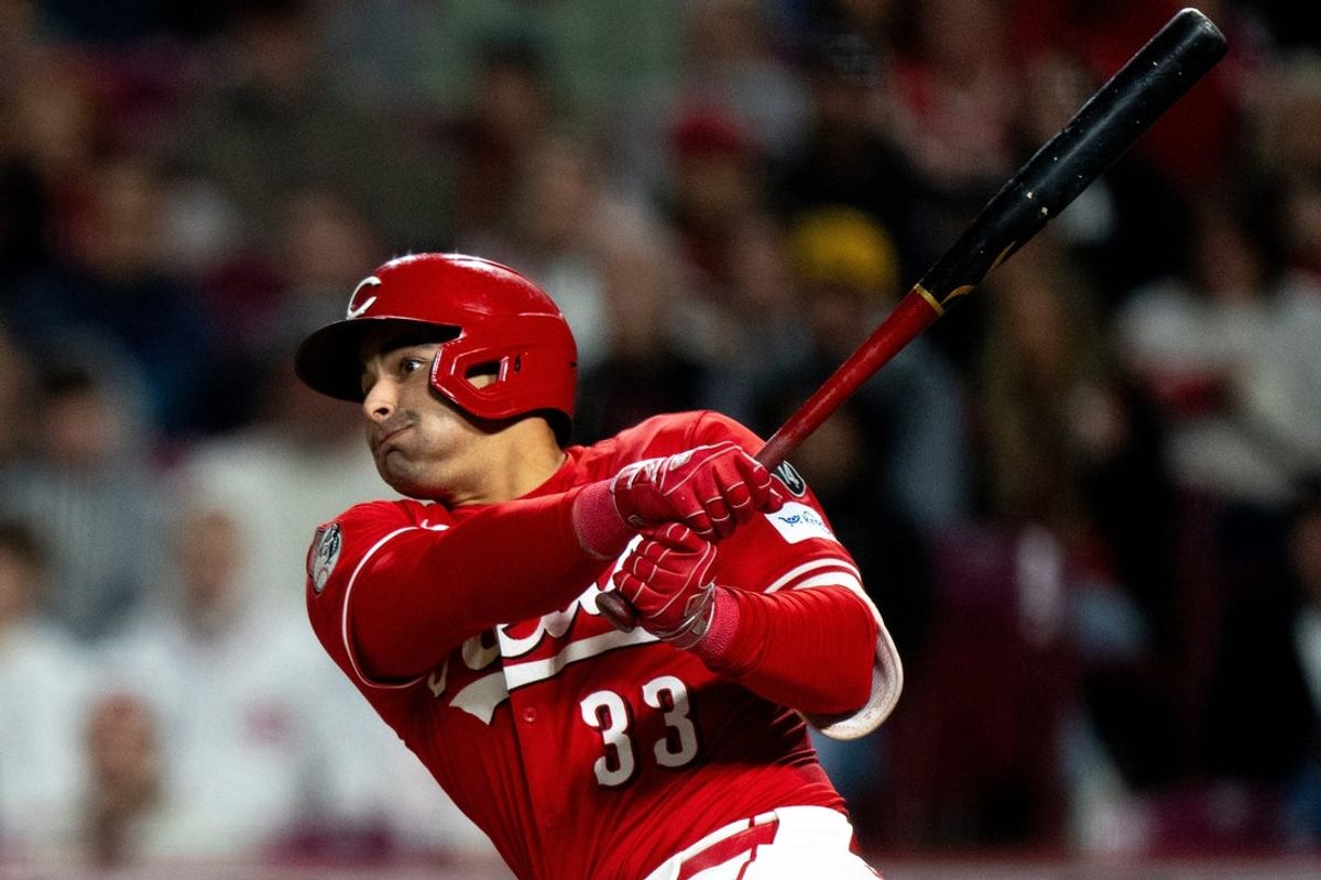 Cincinnati Reds first baseman Christian Encarnacion-Strand (33) hits a RBI double in the seventh inning of the MLB game between Cincinnati Reds and Seattle Mariners at Great American Ball Park in Cincinnati on Wednesday, April 16, 2025.