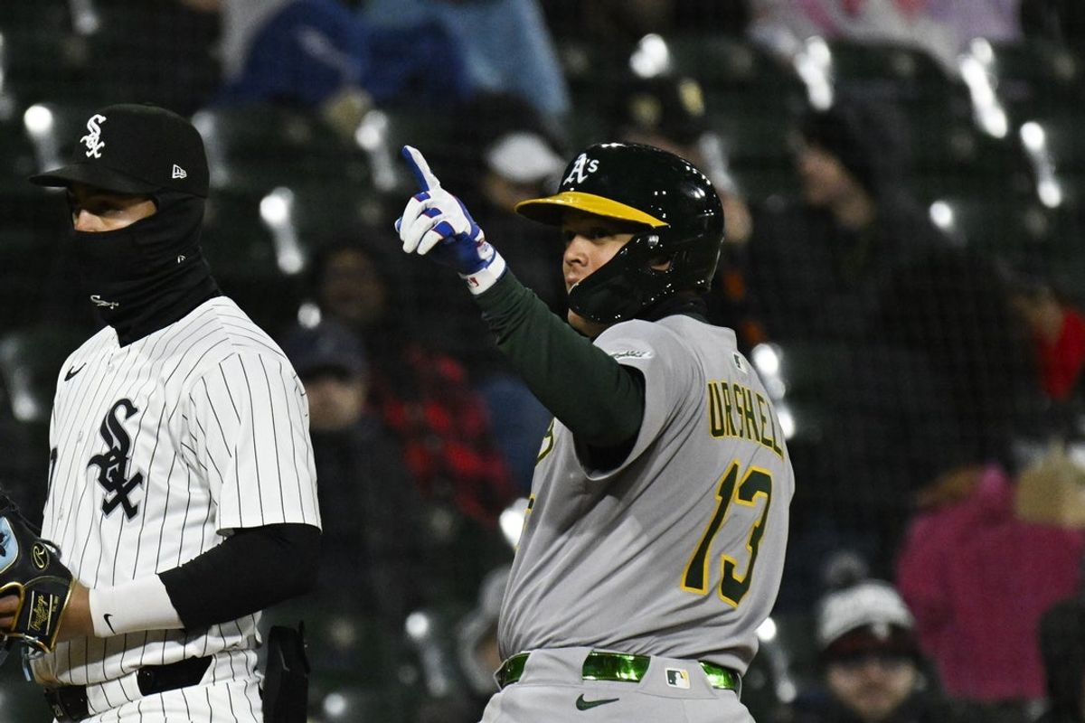 Apr 16, 2025; Chicago, Illinois, USA;  Athletics third baseman Gio Urshela (13) points after he hits a two RBI triple  against the Chicago White Sox  during the sixth inning at Rate Field. Mandatory Credit: Matt Marton-Imagn Images