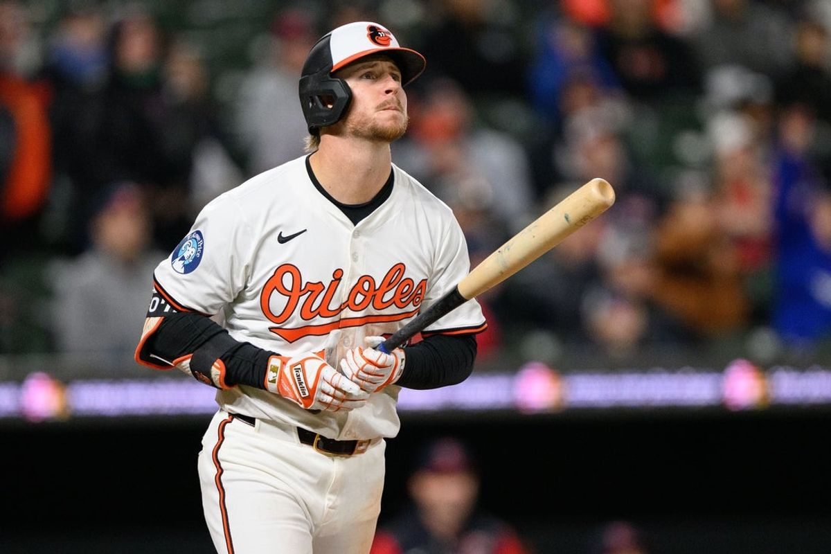 Apr 16, 2025; Baltimore, Maryland, USA; Baltimore Orioles first baseman Ryan O'Hearn (32) reacts while hitting a home run during the eighth inning against the Cleveland Guardians at Oriole Park at Camden Yards. Mandatory Credit: Reggie Hildred-Imagn Images