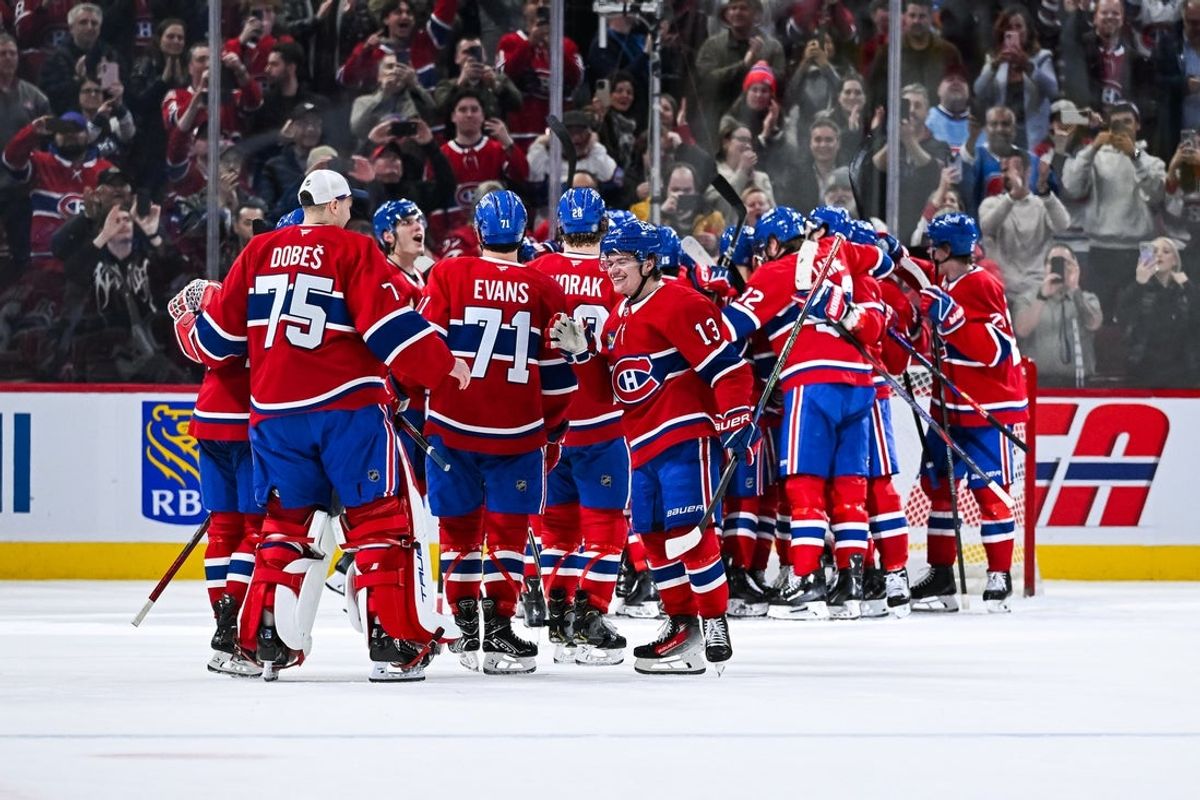 Apr 16, 2025; Montreal, Quebec, CAN; Montreal Canadiens players gather to celebrate their win against the Carolina Hurricanes in the third period at Bell Centre. Mandatory Credit: David Kirouac-Imagn Images