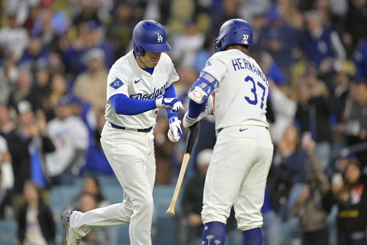Apr 16, 2025; Los Angeles, California, USA; Los Angeles Dodgers first baseman Freddie Freeman (5) celebrates with left fielder Teoscar Hernandez (37) after scoring a solo home run against the Colorado Rockies in the first inning at Dodger Stadium. Mandatory Credit: Jayne Kamin-Oncea-Imagn Images