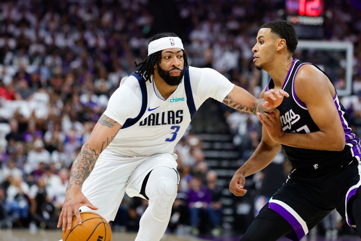 Apr 16, 2025; Sacramento, California, USA; Dallas Mavericks forward Anthony Davis (3) dribbles the ball against Sacramento Kings forward Keegan Murray (13) during the first quarter at Golden 1 Center. Mandatory Credit: Sergio Estrada-Imagn Images