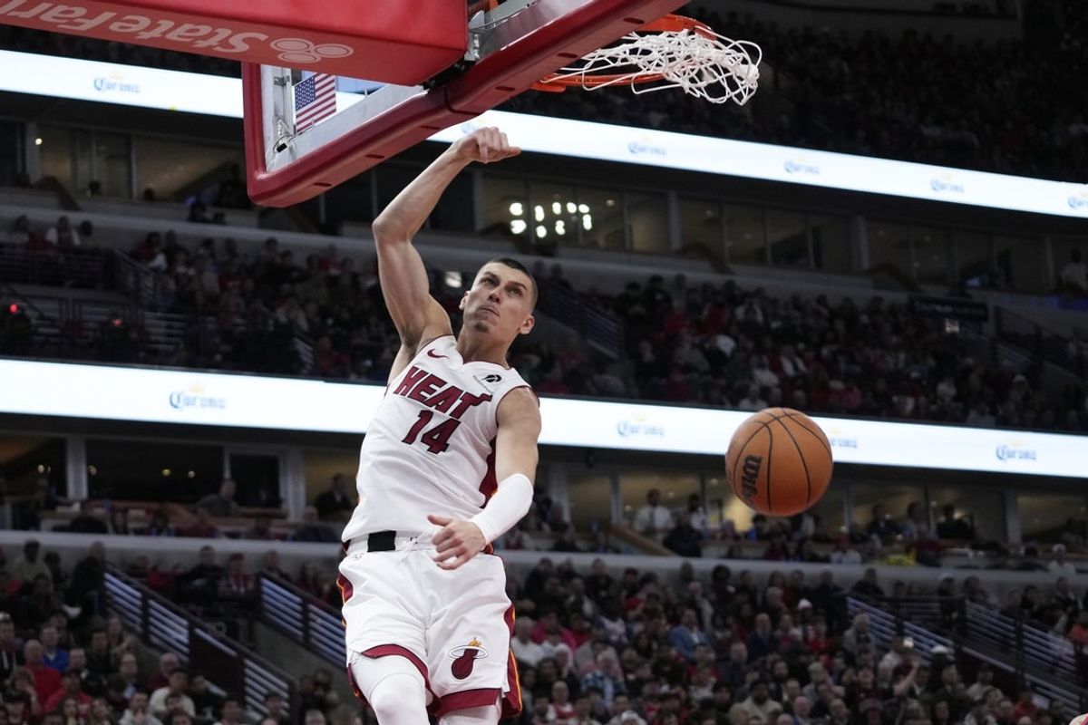 Apr 16, 2025; Chicago, Illinois, USA; Miami Heat guard Tyler Herro (14) dunks the ball against the Chicago Bulls during the second half at United Center. Mandatory Credit: David Banks-Imagn Images