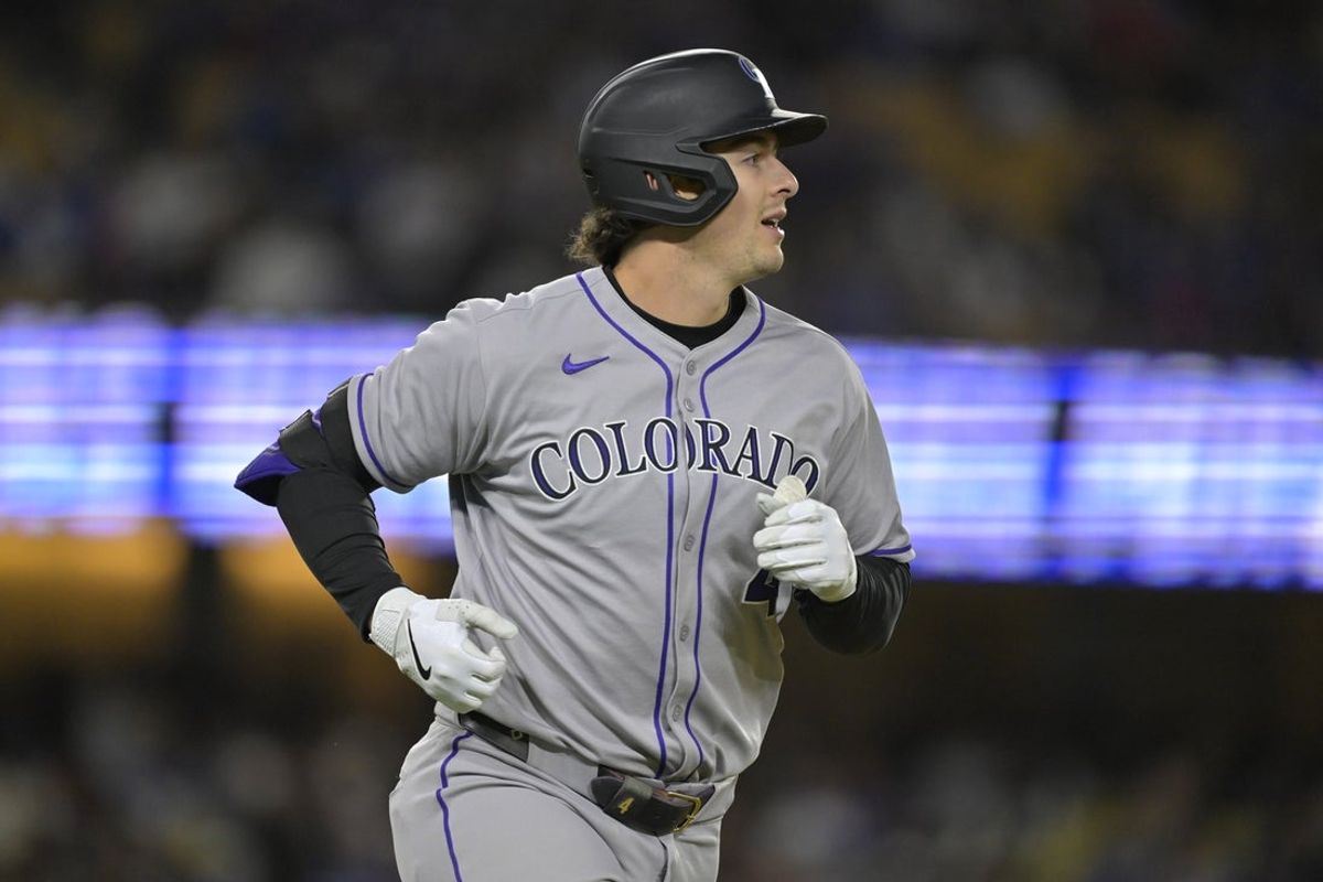 Apr 16, 2025; Los Angeles, California, USA; Colorado Rockies first base Michael Toglia (4) runs after hitting a grand slam home run in the third inning against the Los Angeles Dodgers at Dodger Stadium. Mandatory Credit: Jayne Kamin-Oncea-Imagn Images