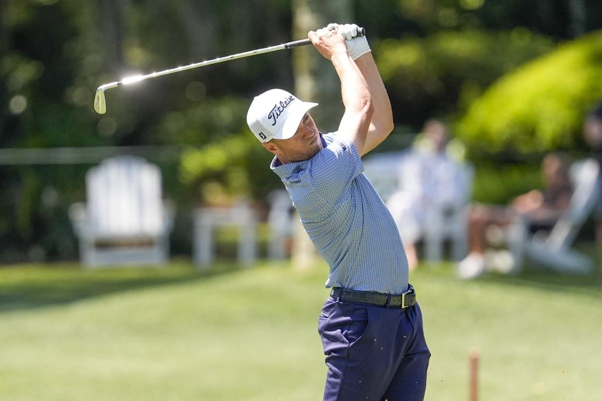 Apr 17, 2025; Hilton Head, South Carolina, USA; Justin Thomas hits his approach shot to eight green during the first round of the RBC Heritage golf tournament. Mandatory Credit: Jim Dedmon-Imagn Images