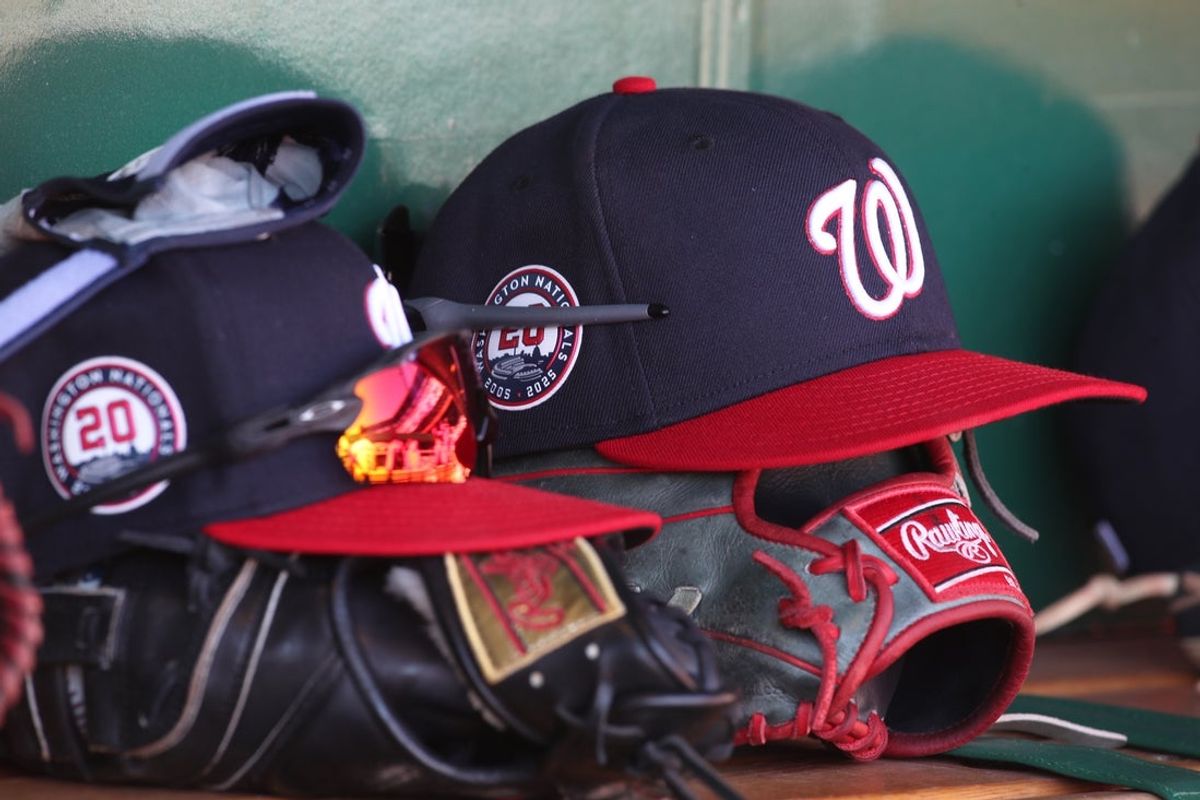 Apr 17, 2025; Pittsburgh, Pennsylvania, USA; Washington Nationals hats and gloves in the dugout against the Pittsburgh Pirates during the sixth inning at PNC Park. Mandatory Credit: Charles LeClaire-Imagn Images