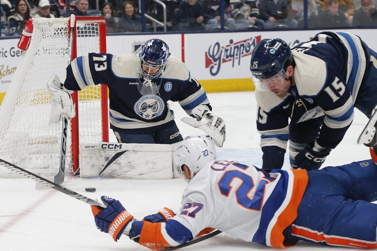 Apr 17, 2025; Columbus, Ohio, USA; Columbus Blue Jackets goalie Jet Greaves (73) makes a save against the New York Islanders during the first period at Nationwide Arena. Mandatory Credit: Russell LaBounty-Imagn Images
