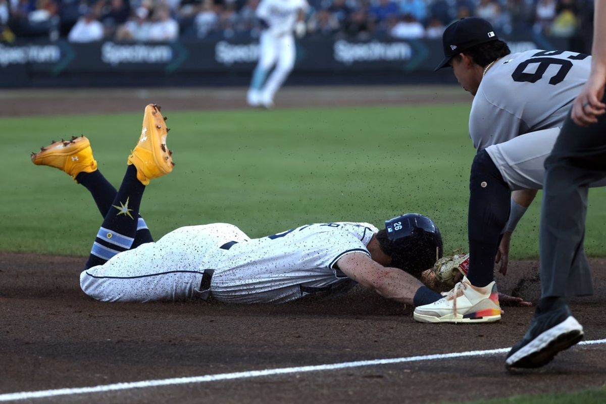 Apr 17, 2025; St. Petersburg, Florida, USA;  New York Yankees third base Oswaldo Cabrera (95) tags out Tampa Bay Rays outfielder Kameron Misner (26) during the first inningat George M. Steinbrenner Field. Mandatory Credit: Kim Klement Neitzel-Imagn Images