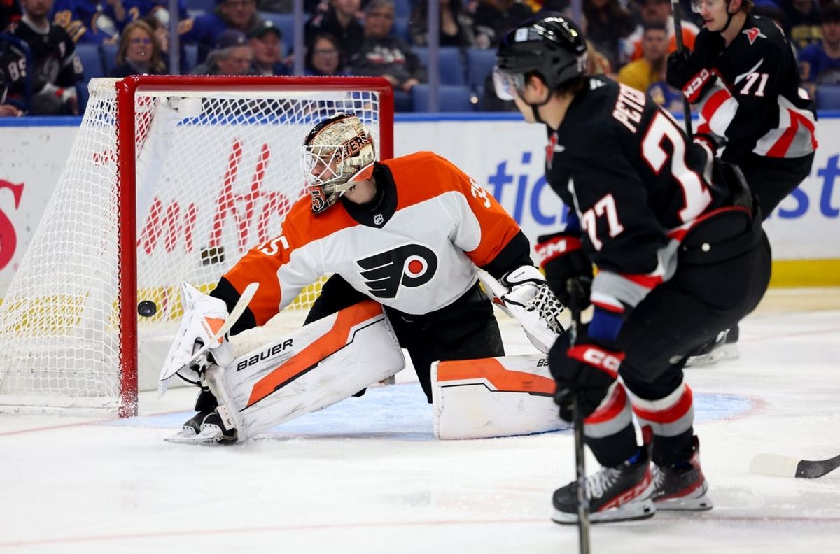Apr 17, 2025; Buffalo, New York, USA;  Buffalo Sabres right wing JJ Peterka (77) scores a goal on Philadelphia Flyers goaltender Aleksei Kolosov (35) during the second period at KeyBank Center. Mandatory Credit: Timothy T. Ludwig-Imagn Images