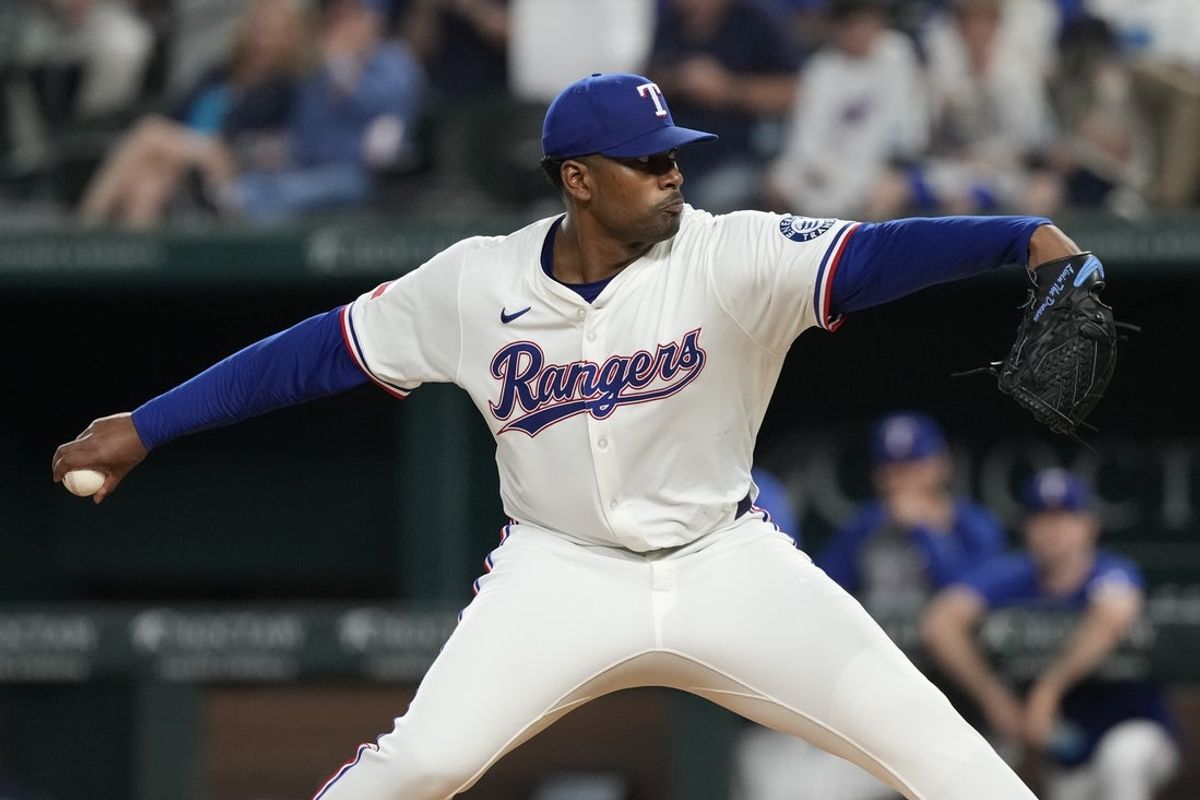 Apr 17, 2025; Arlington, Texas, USA; Texas Rangers starting pitcher Kumar Rocker (80) delivers a pitch to the Los Angeles Angels during the fifth inning at Globe Life Field. Mandatory Credit: Jim Cowsert-Imagn Images