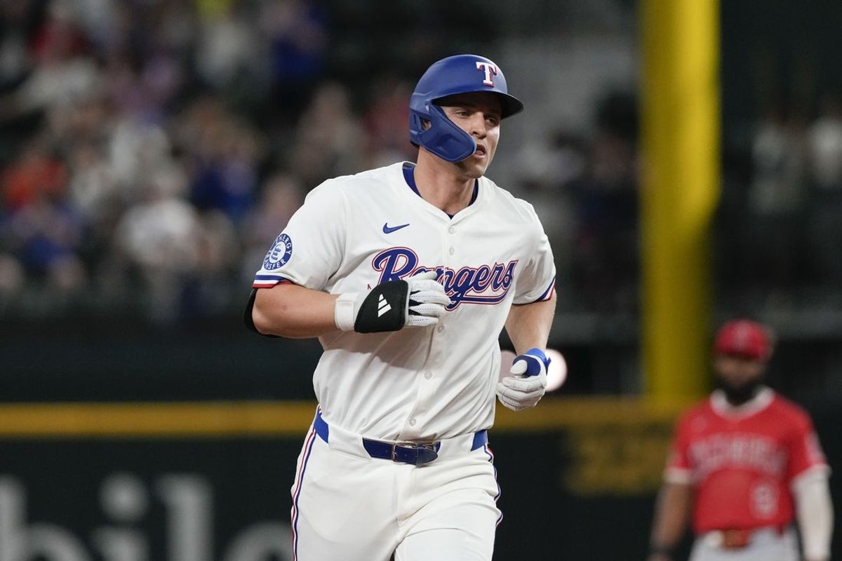 Apr 17, 2025; Arlington, Texas, USA; Texas Rangers shortstop Corey Seager (5) rounds the bases on his solo home run against the Los Angeles Angels during the seventh inning at Globe Life Field. Seager’s home run was his 100th as a Texas Ranger. Mandatory Credit: Jim Cowsert-Imagn Images