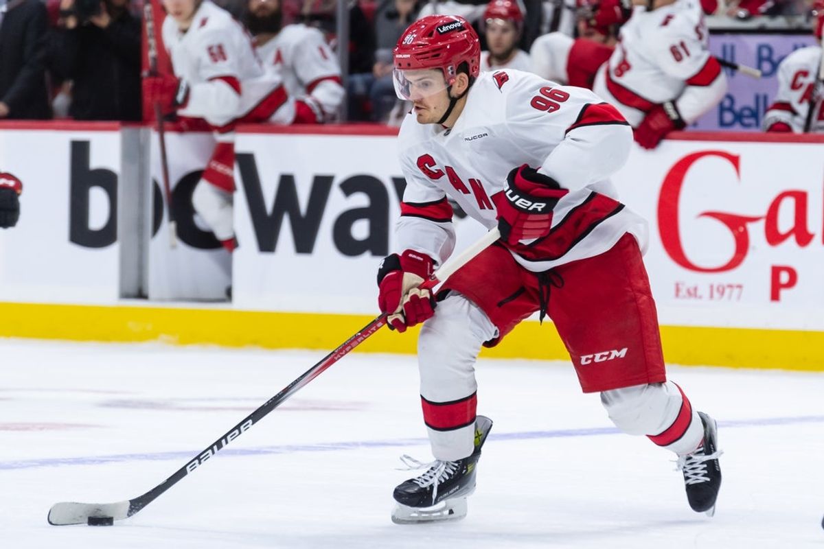 Apr 17, 2025; Ottawa, Ontario, CAN; Carolina Hurricanes center Jack Roslovic (96) skates with the puck in the second period against the Ottawa Senators at the Canadian Tire Centre. Mandatory Credit: Marc DesRosiers-Imagn Images