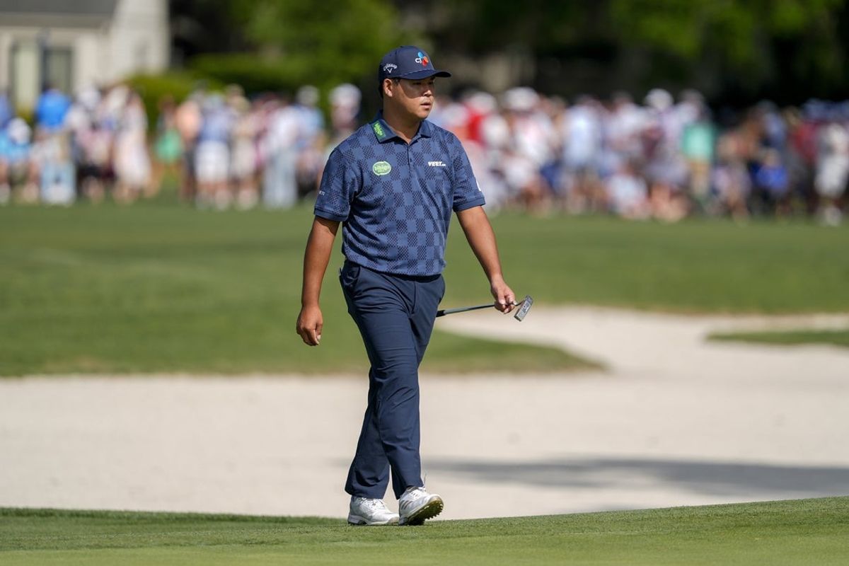 Apr 18, 2025; Hilton Head, South Carolina, USA; Si Woo Kim walks up to the 16th green during the second round of the RBC Heritage golf tournament. Mandatory Credit: Jim Dedmon-Imagn Images