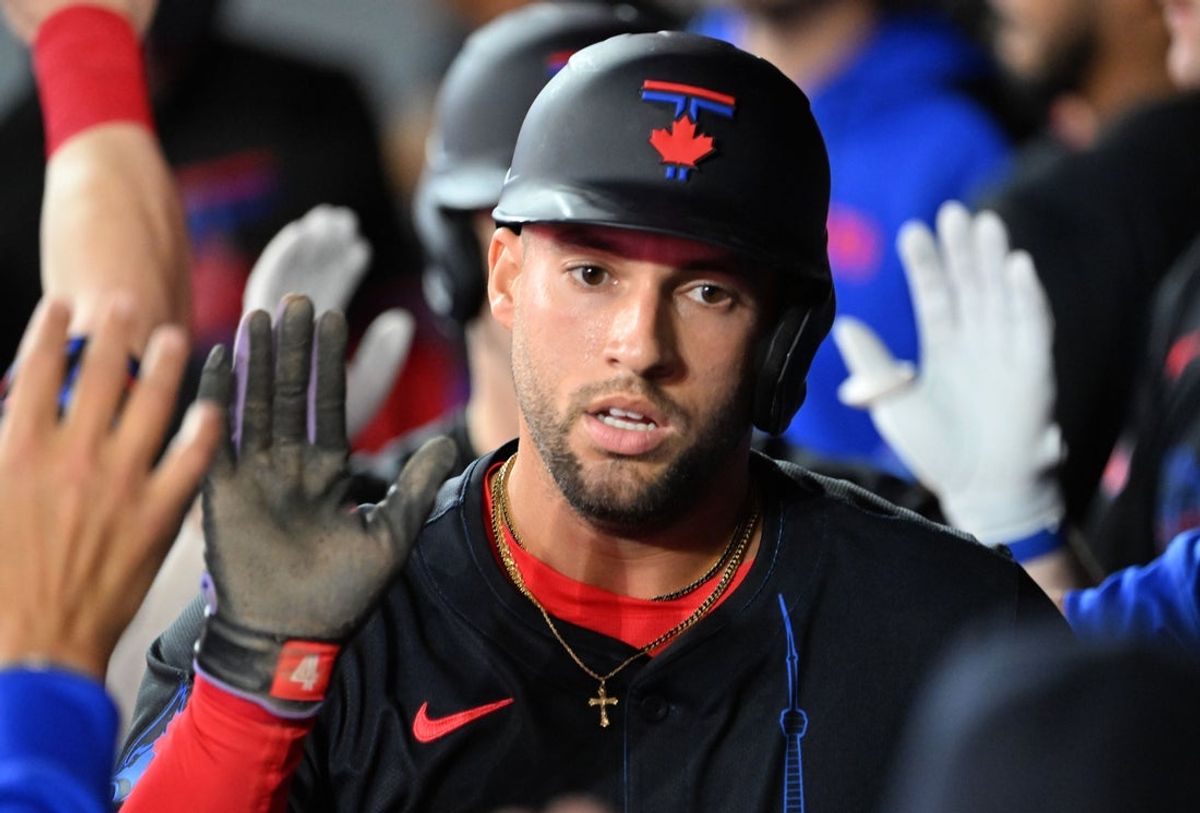 Apr 18, 2025; Toronto, Ontario, CAN;  Toronto Blue Jays center fielder George Springer (4) celebrates with teammates in the dugout after scoring against the Seattle Mariners in the second inning at Rogers Centre. Mandatory Credit: Dan Hamilton-Imagn Images