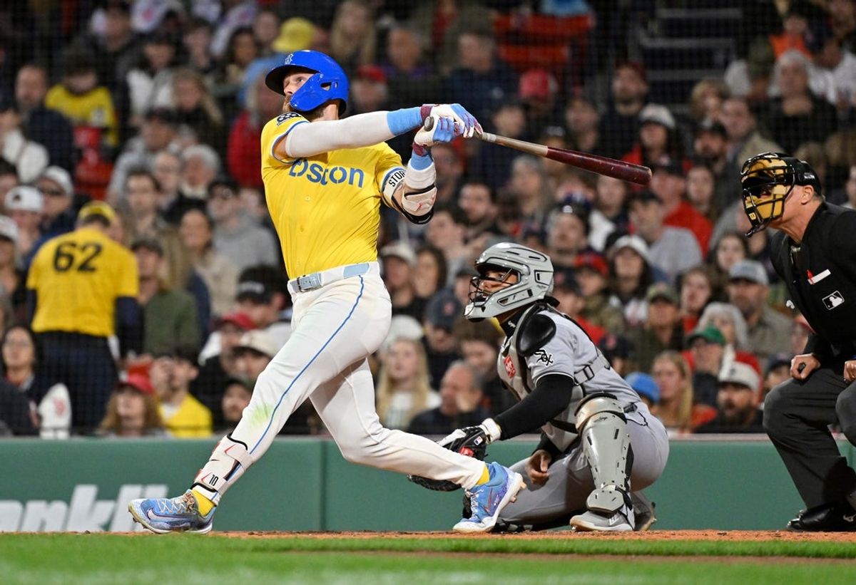 Apr 18, 2025; Boston, Massachusetts, USA; Boston Red Sox shortstop Trevor Story (10) hits a two-run home run against the Chicago White Sox during the seventh inning at Fenway Park. Mandatory Credit: Eric Canha-Imagn Images