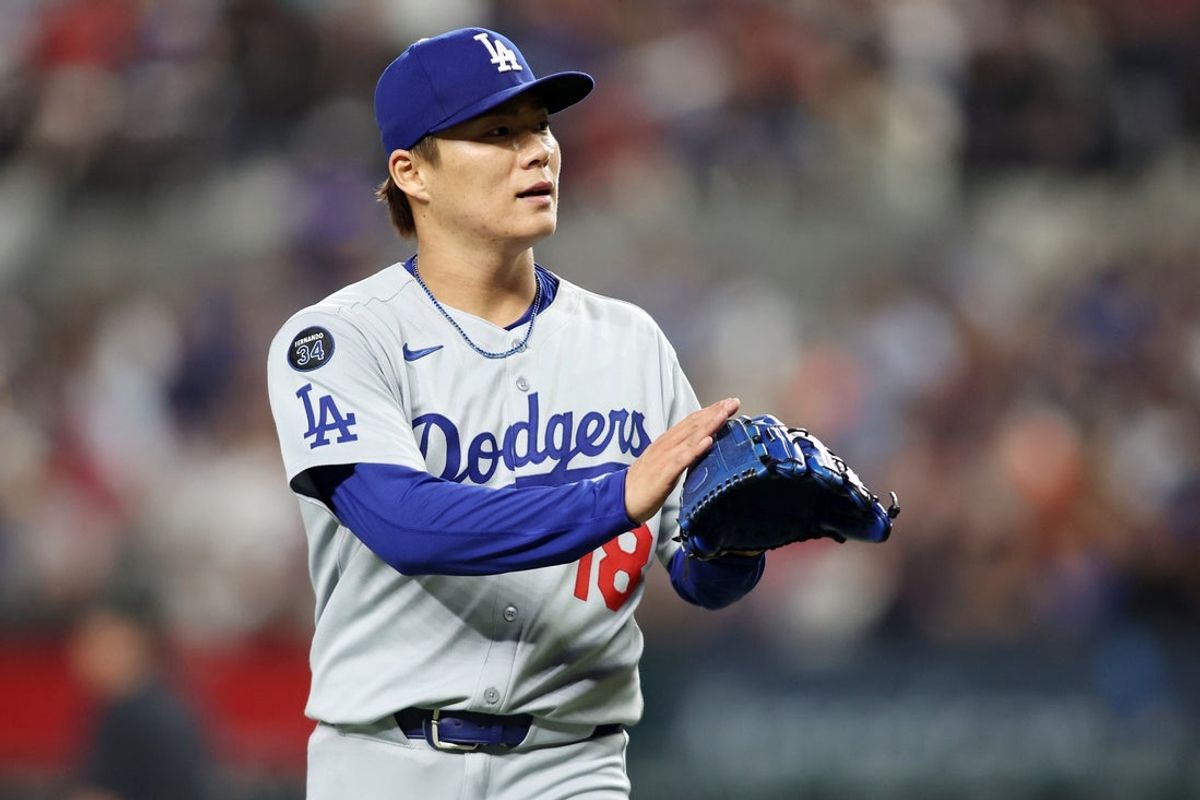 Apr 18, 2025; Arlington, Texas, USA; Los Angeles Dodgers pitcher Yoshinobu Yamamoto (18) reacts after an out during the fourth inning against the Texas Rangers at Globe Life Field. Mandatory Credit: Tim Heitman-Imagn Images