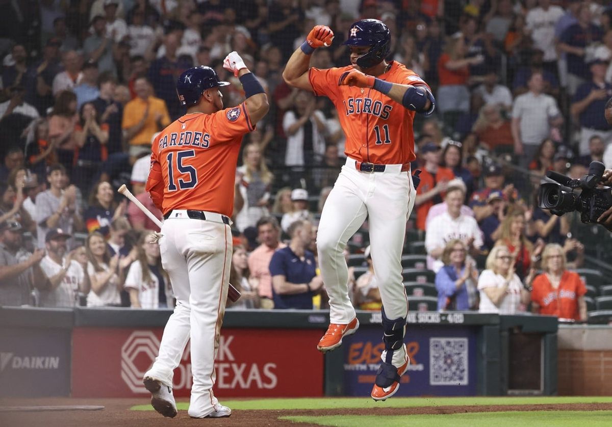 Apr 18, 2025; Houston, Texas, USA; Houston Astros right fielder Cam Smith (11) celebrates with third baseman Isaac Paredes (15) after hitting a home run during the fourth inning against the San Diego Padres at Daikin Park. Mandatory Credit: Troy Taormina-Imagn Images