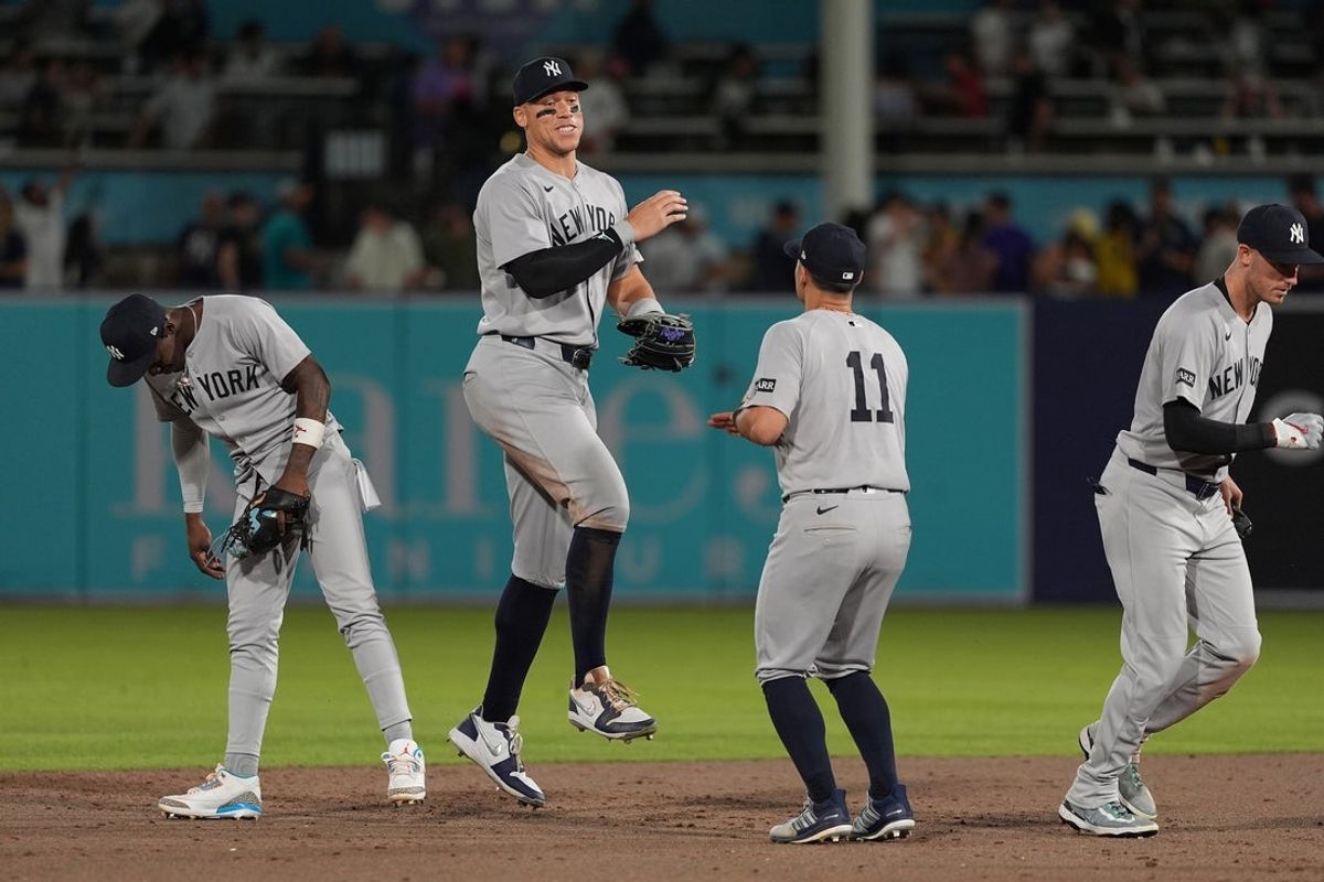 Apr 18, 2025; Tampa, Florida, USA; New York Yankees outfielder Aaron Judge (99) and Anthony Volpe (11) celebrate after defeating the Tampa Bay Rays at George M. Steinbrenner Field. Mandatory Credit: Dave Nelson-Imagn Images