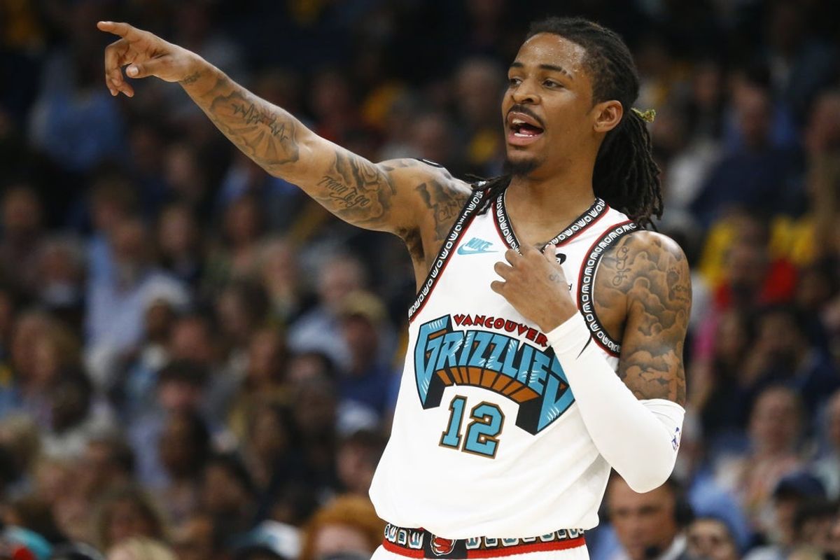 Apr 18, 2025; Memphis, Tennessee, USA; Memphis Grizzlies guard Ja Morant (12) reacts during the second quarter against the Dallas Mavericks at FedExForum. Mandatory Credit: Petre Thomas-Imagn Images