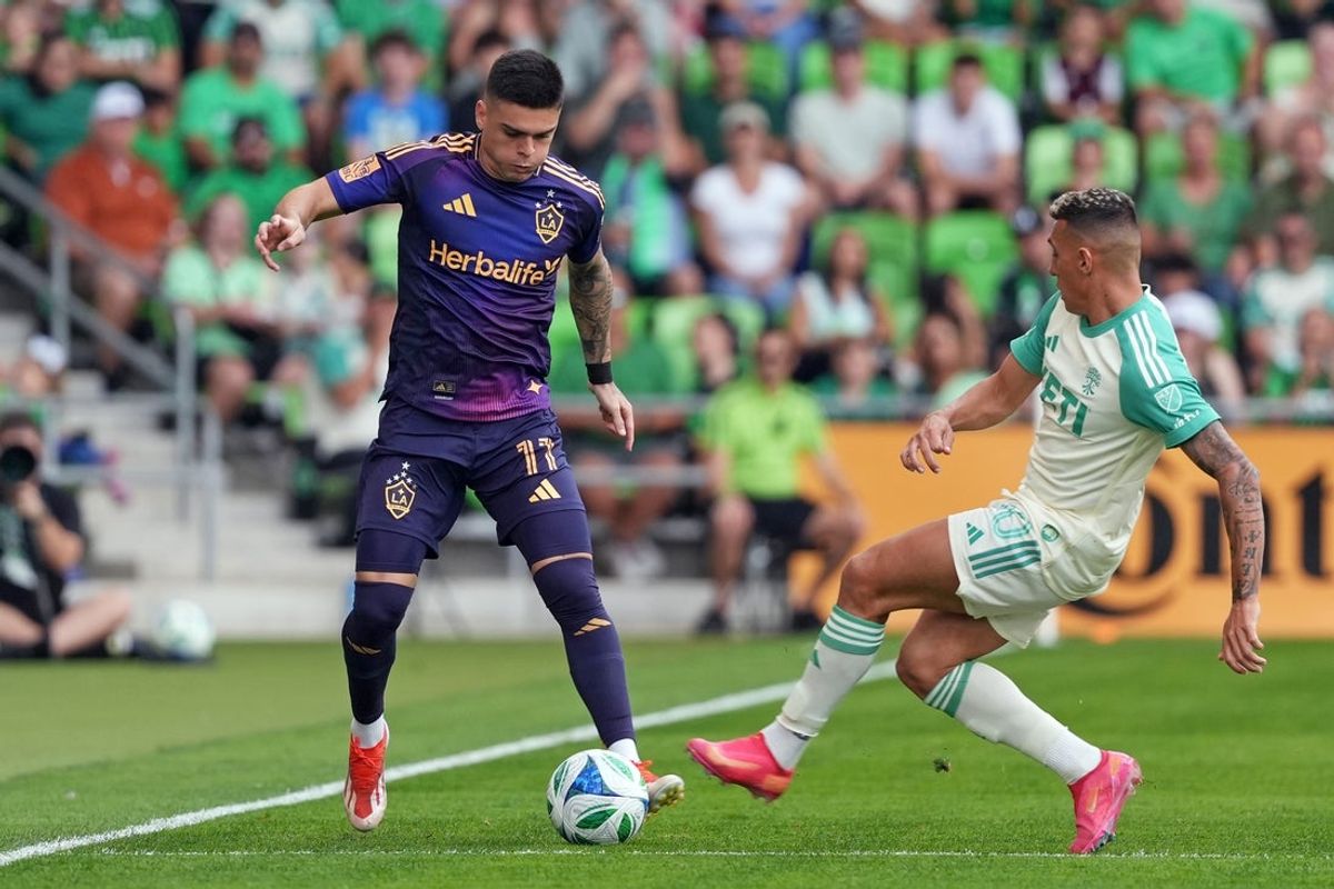 Apr 19, 2025; Austin, Texas, USA; LA Galaxy forward Gabriel Pec (11) and Austin FC forward Myrto Uzuni (10) battle for the ball during the first half at Q2 Stadium. Mandatory Credit: Scott Wachter-Imagn Images