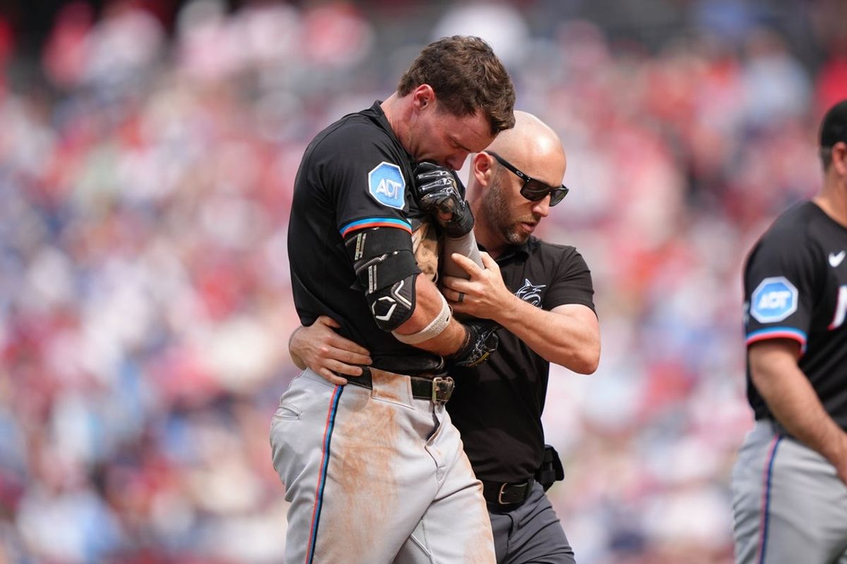 Apr 19, 2025; Philadelphia, Pennsylvania, USA; Miami Marlins outfielder Griffin Conine (18) leaves the field after an injury against the Philadelphia Phillies in the sixth inning at Citizens Bank Park. Mandatory Credit: Kyle Ross-Imagn Images