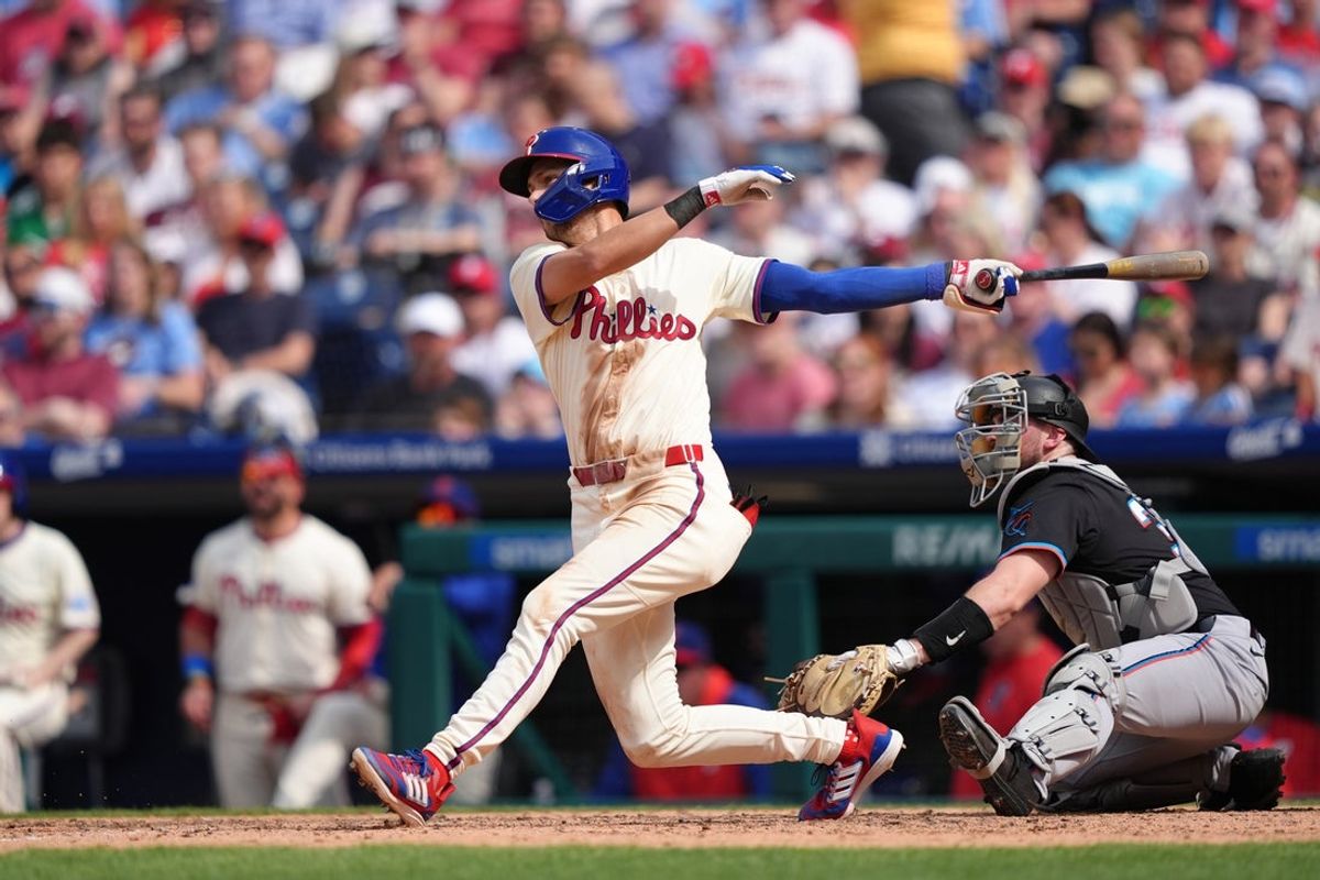 Apr 19, 2025; Philadelphia, Pennsylvania, USA; Philadelphia Phillies infielder Trea Turner (7) hits a single against the Miami Marlins in the seventh inning at Citizens Bank Park. Mandatory Credit: Kyle Ross-Imagn Images
