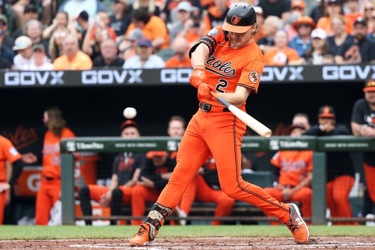 Apr 19, 2025; Baltimore, Maryland, USA; Baltimore Orioles shortstop Gunnar Henderson (2) hits a home run during the first inning against the Cincinnati Reds at Oriole Park at Camden Yards. Mandatory Credit: Daniel Kucin Jr.-Imagn Images