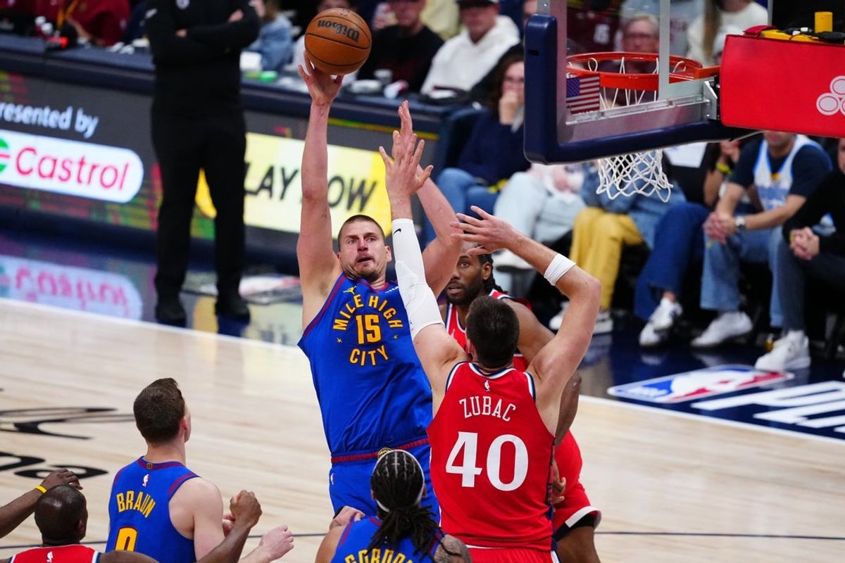 Apr 19, 2025; Denver, Colorado, USA; Denver Nuggets center Nikola Jokic (15) shoots the ball over LA Clippers center Ivica Zubac (40) in the second quarter at Ball Arena. Mandatory Credit: Ron Chenoy-Imagn Images