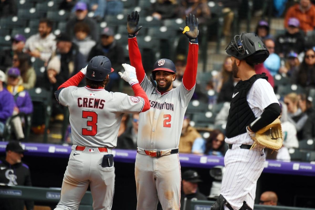 Apr 19, 2025; Denver, Colorado, USA; Washington Nationals outfielder Dylan Crews (3) is congratulated by second base Luis García Jr. (2) after hitting his second home run of the game during the fifth inning against the Colorado Rockies at Coors Field. Mandatory Credit: Christopher Hanewinckel-Imagn Images