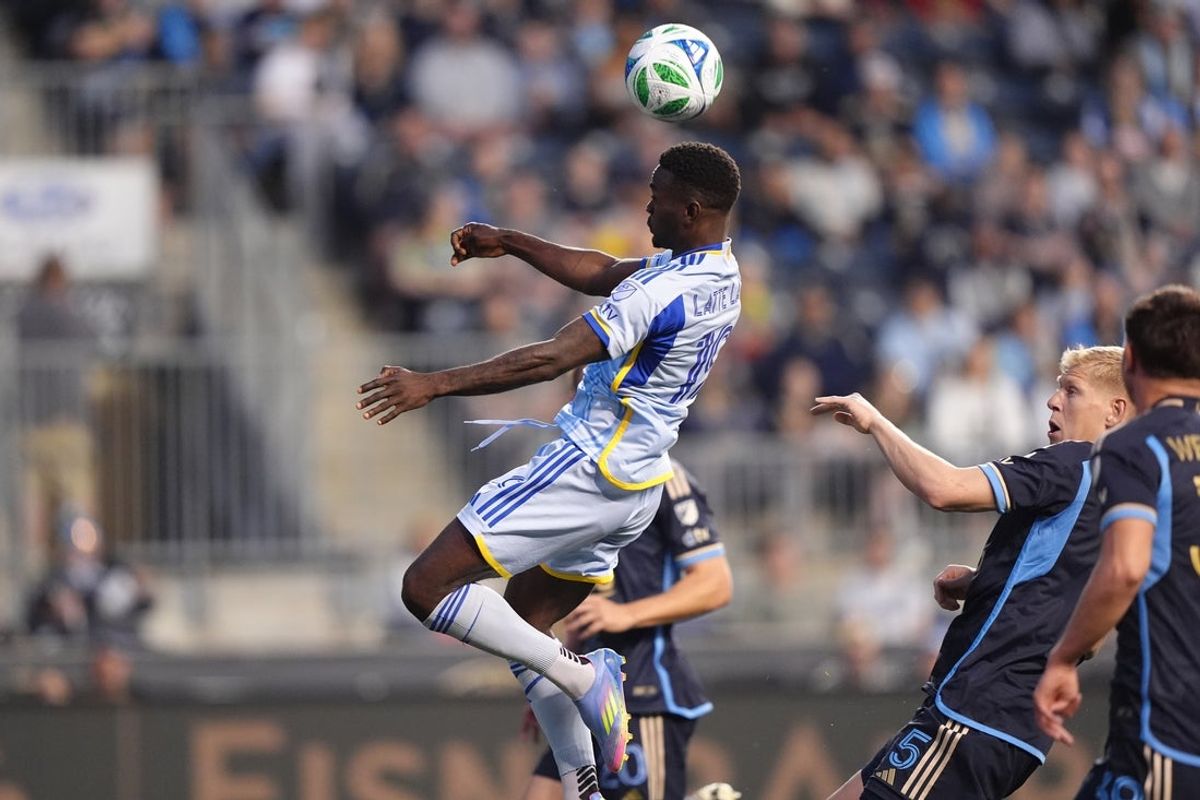 Apr 19, 2025; Chester, Pennsylvania, USA; Atlanta United forward Emmanuel Latte Lath (19) jumps for a header against the Philadelphia Union in the first half at Subaru Park. Mandatory Credit: Kyle Ross-Imagn Images