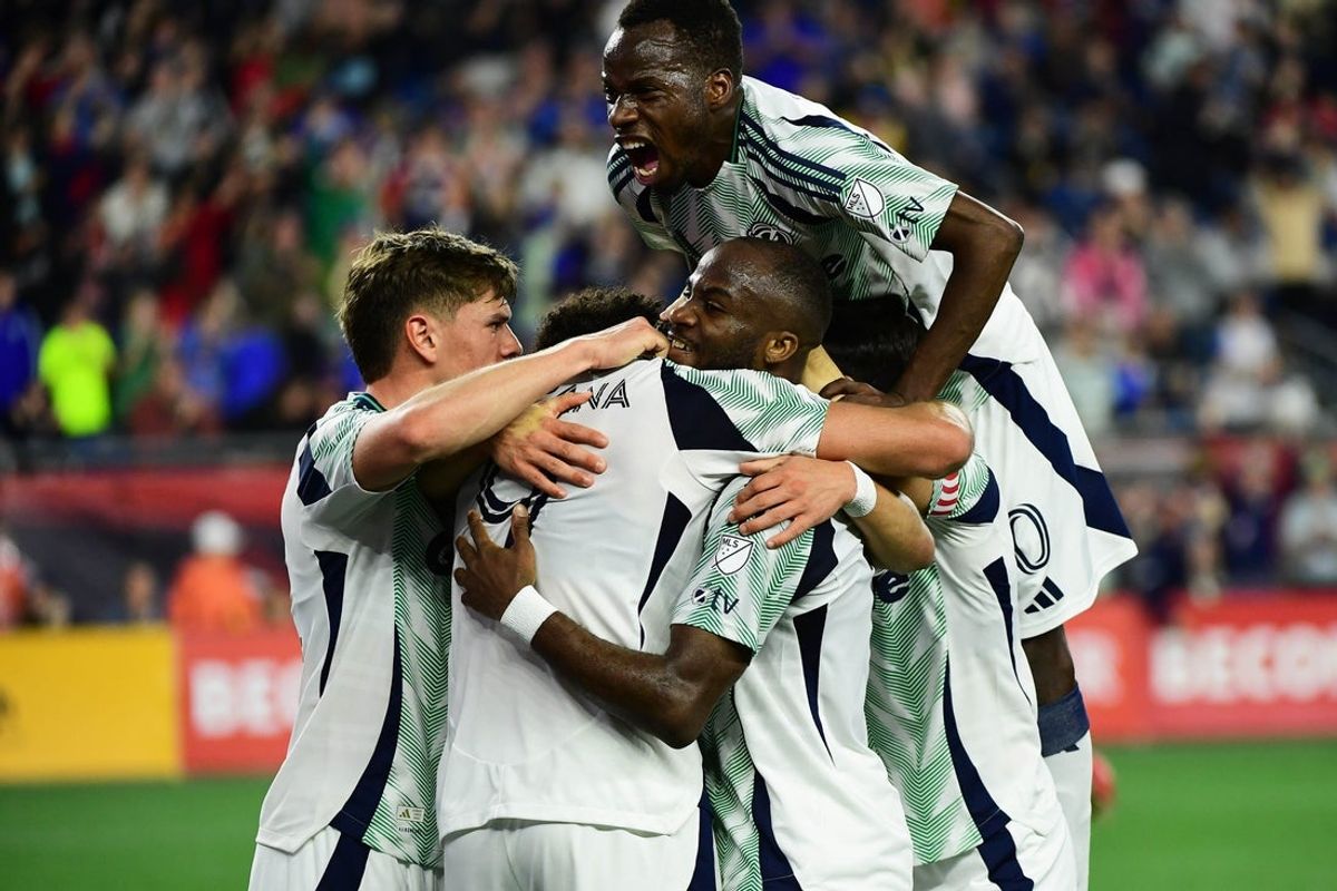 Apr 19, 2025; Foxborough, Massachusetts, USA; New England Revolution midfielder Alhassan Yusuf (80) jumps on his teammates after a goal by forward Leonardo Campana (9) during the first half against New York City at Gillette Stadium. Mandatory Credit: Bob DeChiara-Imagn Images