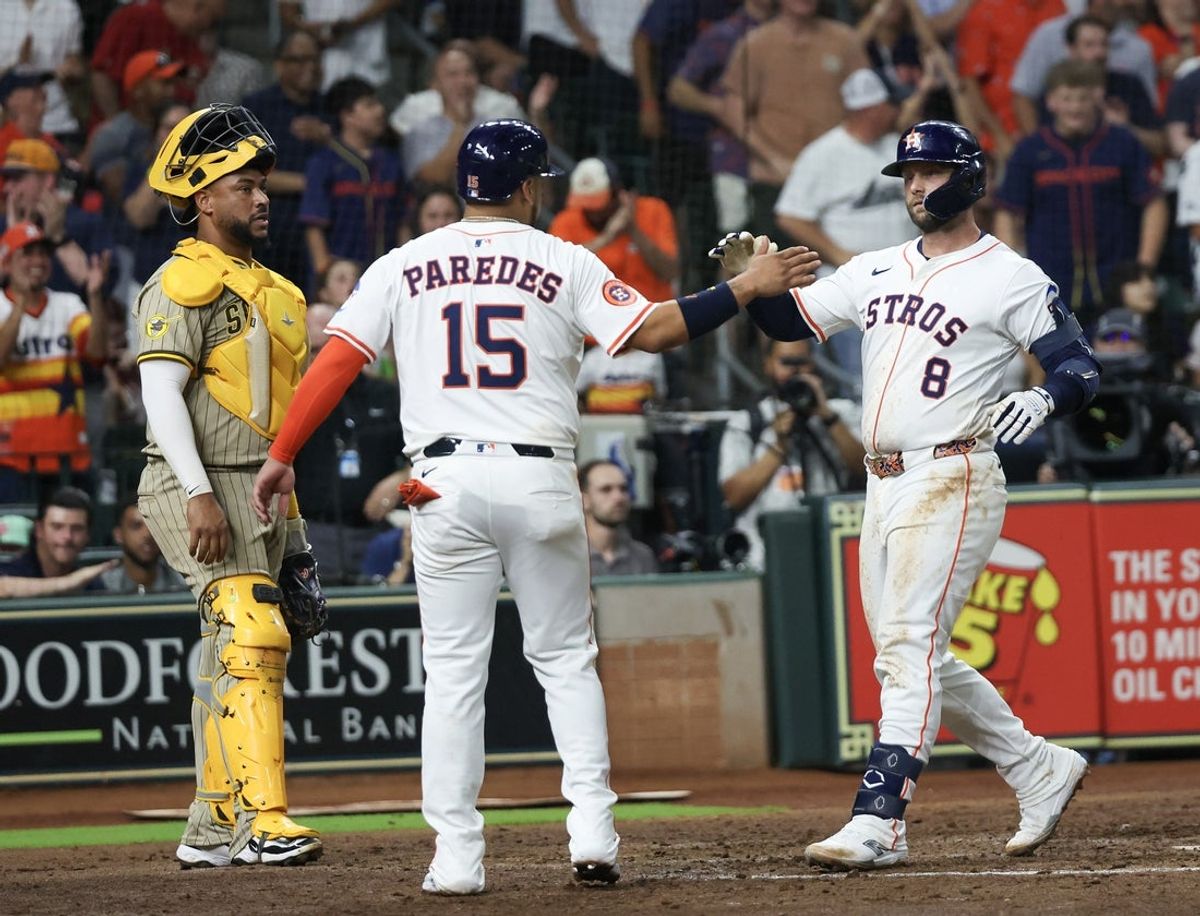 Apr 19, 2025; Houston, Texas, USA; Houston Astros third baseman Isaac Paredes (15) celebrates first baseman Christian Walker (8)  two run home run against the San Diego Padres  in the sixth inning at Daikin Park. Mandatory Credit: Thomas Shea-Imagn Images