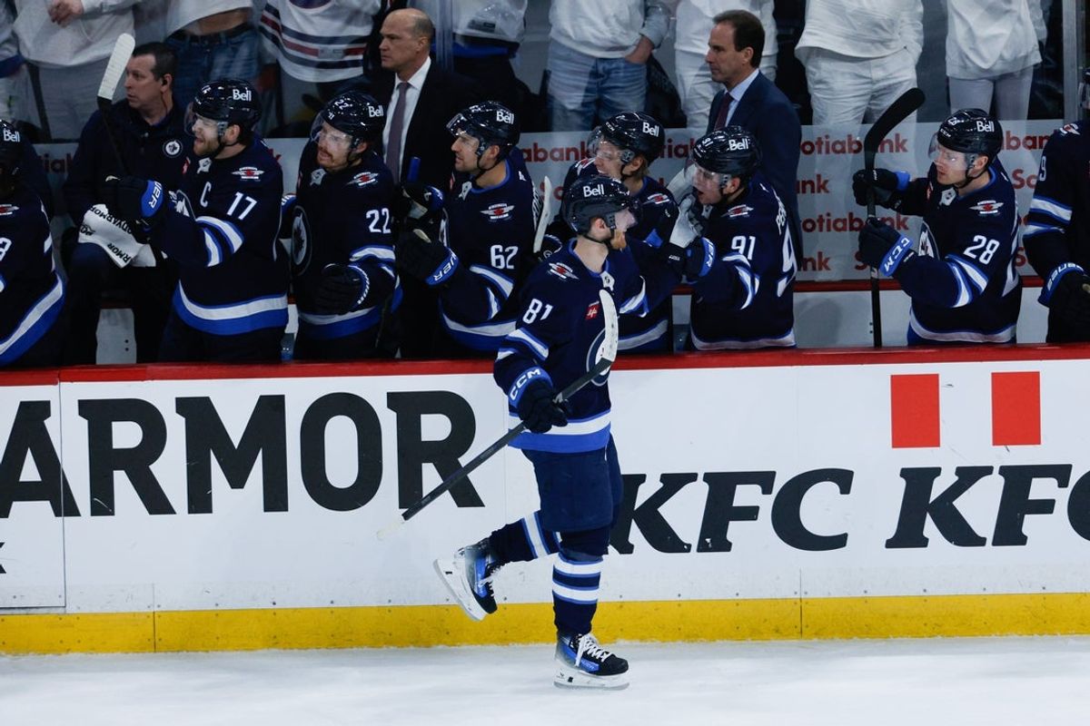 Apr 19, 2025; Winnipeg, Manitoba, CAN; Winnipeg Jets forward Kyle Connor (81) is congratulated by his team mates on his goal against  the St. Louis Blues during the third period in game one of the first round of the 2025 Stanley Cup Playoffs at Canada Life Centre. Mandatory Credit: Terrence Lee-Imagn Images