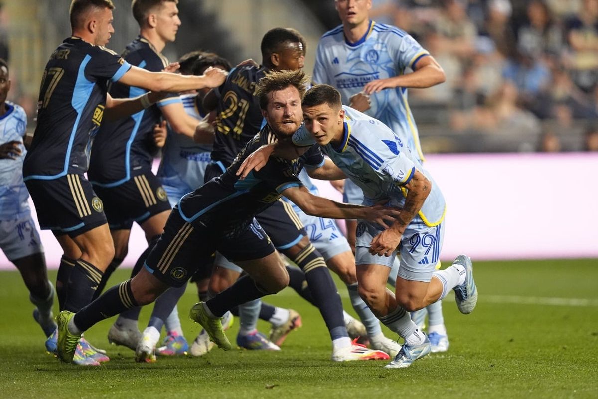 Apr 19, 2025; Chester, Pennsylvania, USA; Atlanta United midfielder Bartosz Slisz (99) and Philadelphia Union midfielder Indiana Vassilev (19) battle for position in the first half at Subaru Park. Mandatory Credit: Kyle Ross-Imagn Images