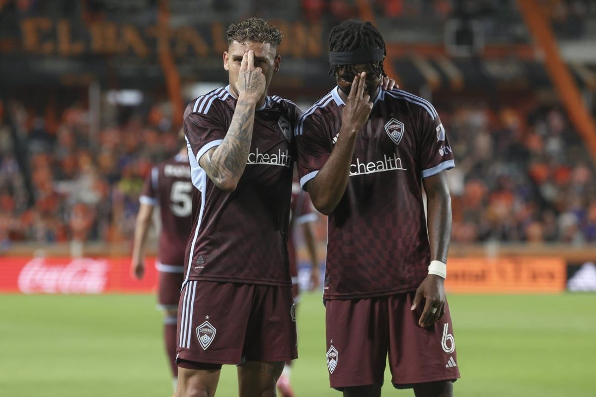 Apr 19, 2025; Houston, Texas, USA; Colorado Rapids forward Rafael Navarro (9) and defender Chidozie Awaziem (6) pose for a picture after Navarro scores a goal during the second half against Houston Dynamo FC at Shell Energy Stadium. Mandatory Credit: Troy Taormina-Imagn Images